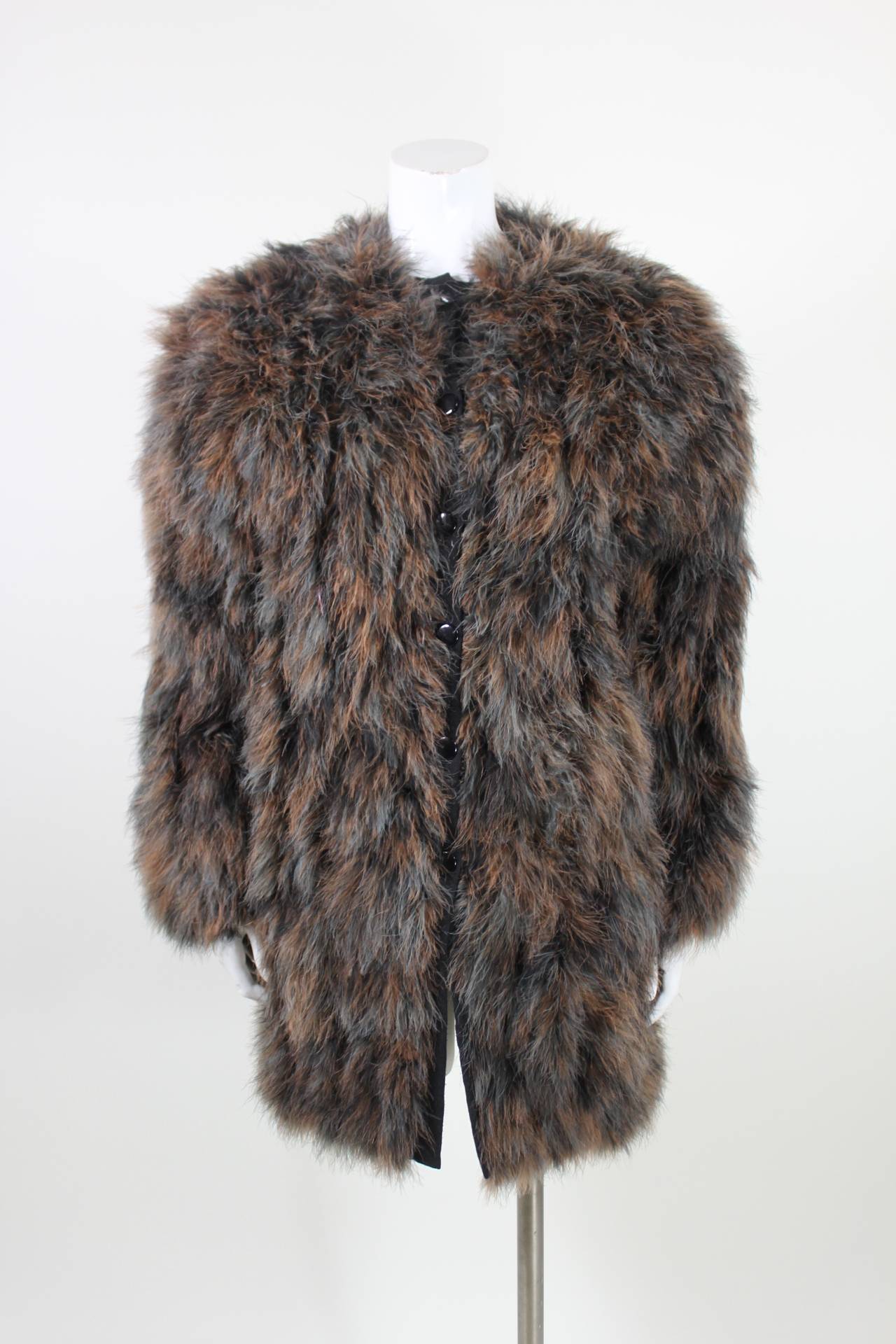 A wonderful marabou jacket featuring a salt-and-pepper color pattern in icy-blue grey and brown. The jacket is fully lined and has a button-front. 
