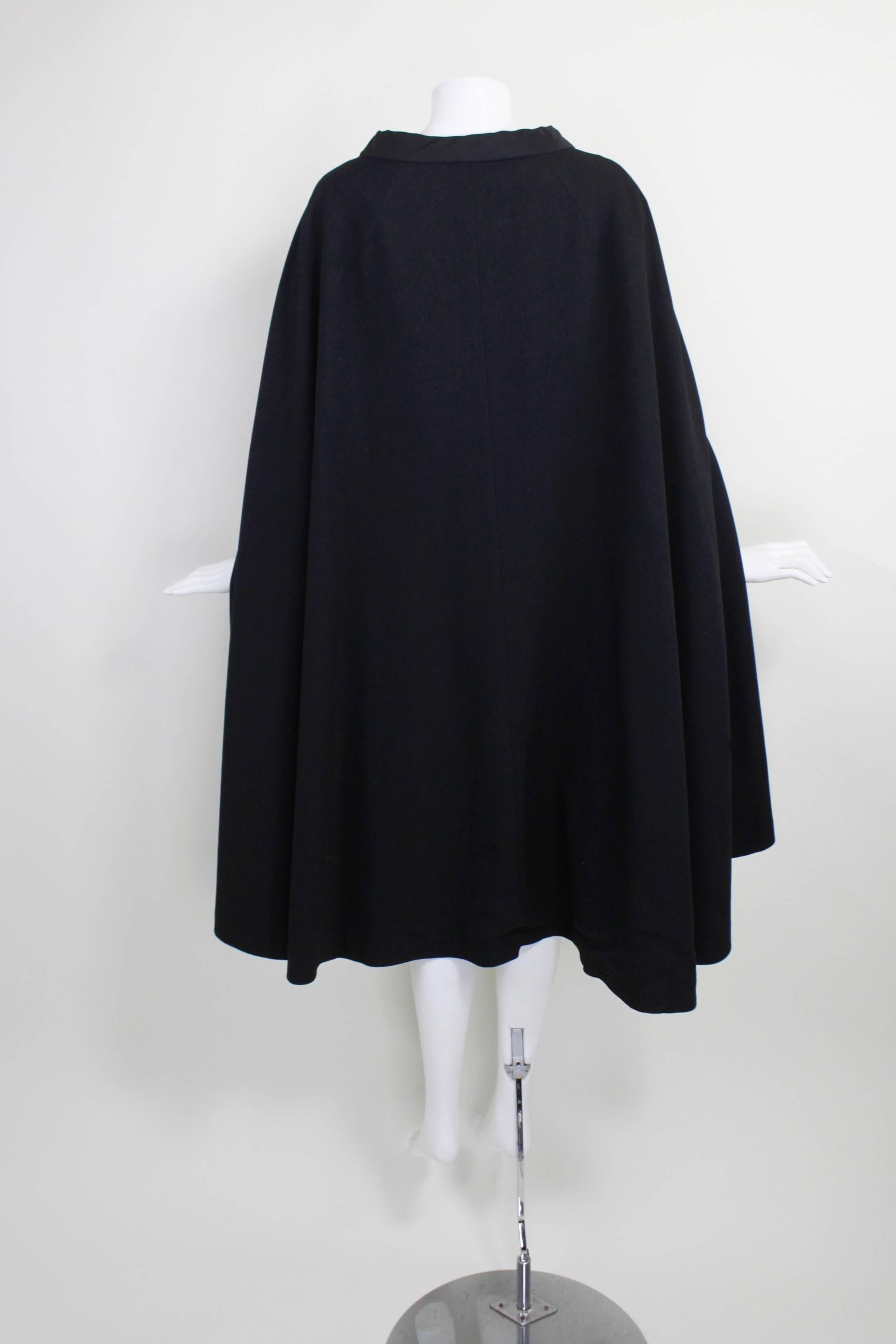 1960s Pierre Cardin Iconic Black Wool Cape with Silk Lining

Measurements--
Lenght, Center Back to Hem: 44 inches