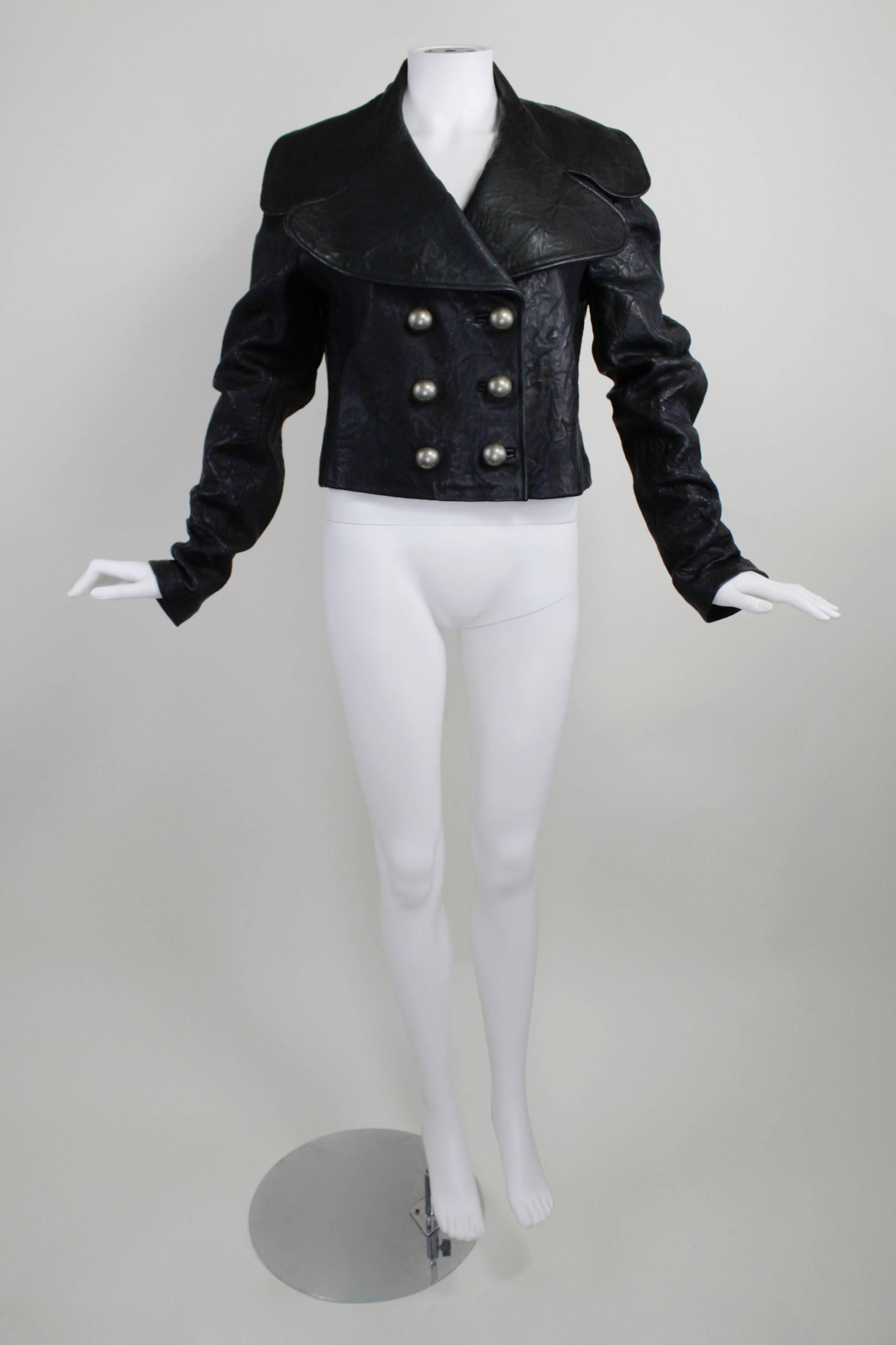 A hearty, rugged double-breasted leather jacket from Thomas Wylde. The jacket features rounded lapels, brass buttons, and a great skull silk lining. 

Measurements--
Bust: 40 inches
Waist: 38 inches
Length, Shoulder to Cuff: 27 inches