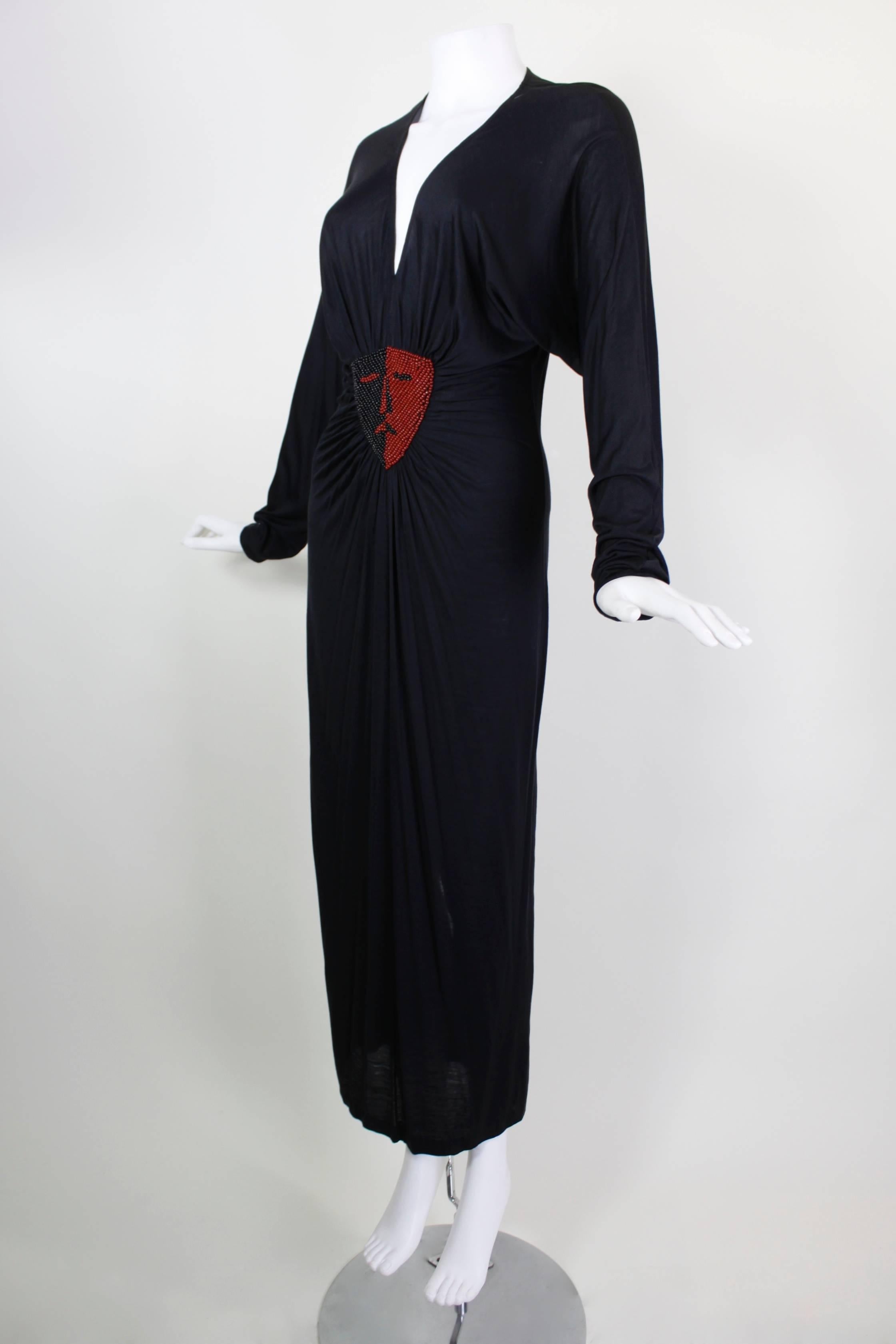 Vintage Callaghan Jersey Dress with Dual Beaded Portrait Motif

Bust: 38 inches
Waist: 28 inches
Hip: 34 inches
Length, Shoulder to Hem: 55 inches
Length, Shoulder to Cuff: 26 inches