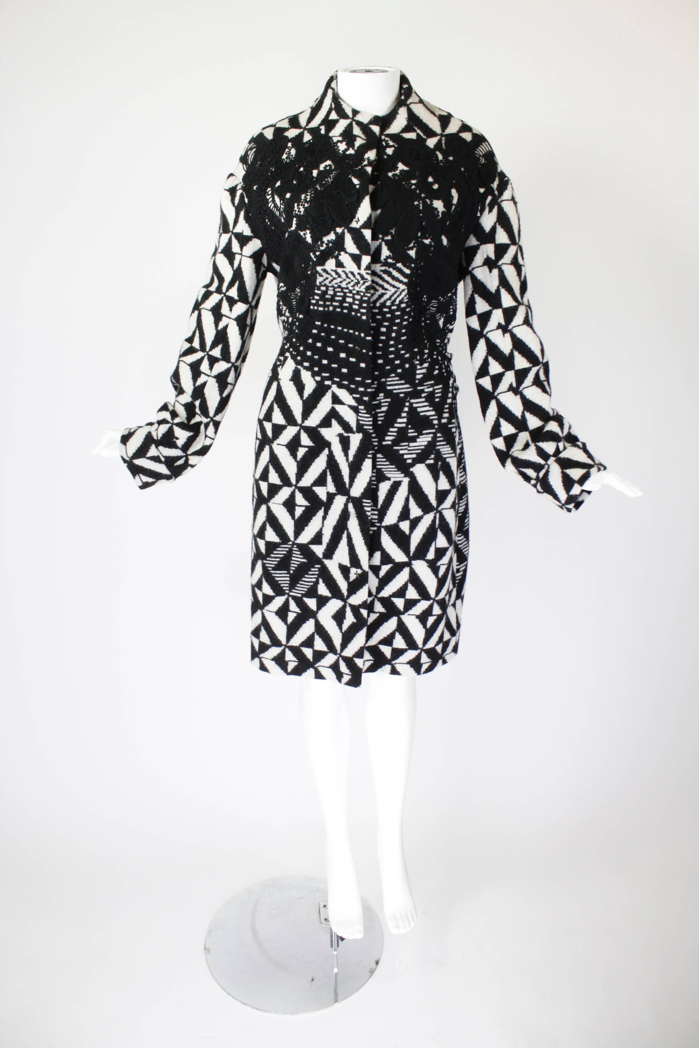 Christian Lacroix Black and White Op Art Coat with Appliqué

-Fully lined
-Snap front closure

Measurements--
Bust: 42 inches
Waist: 36 inches
Hip: 44 inches
Length, Center Back to Hem: 44 inches
Length, Shoulder to Shoulder: 21