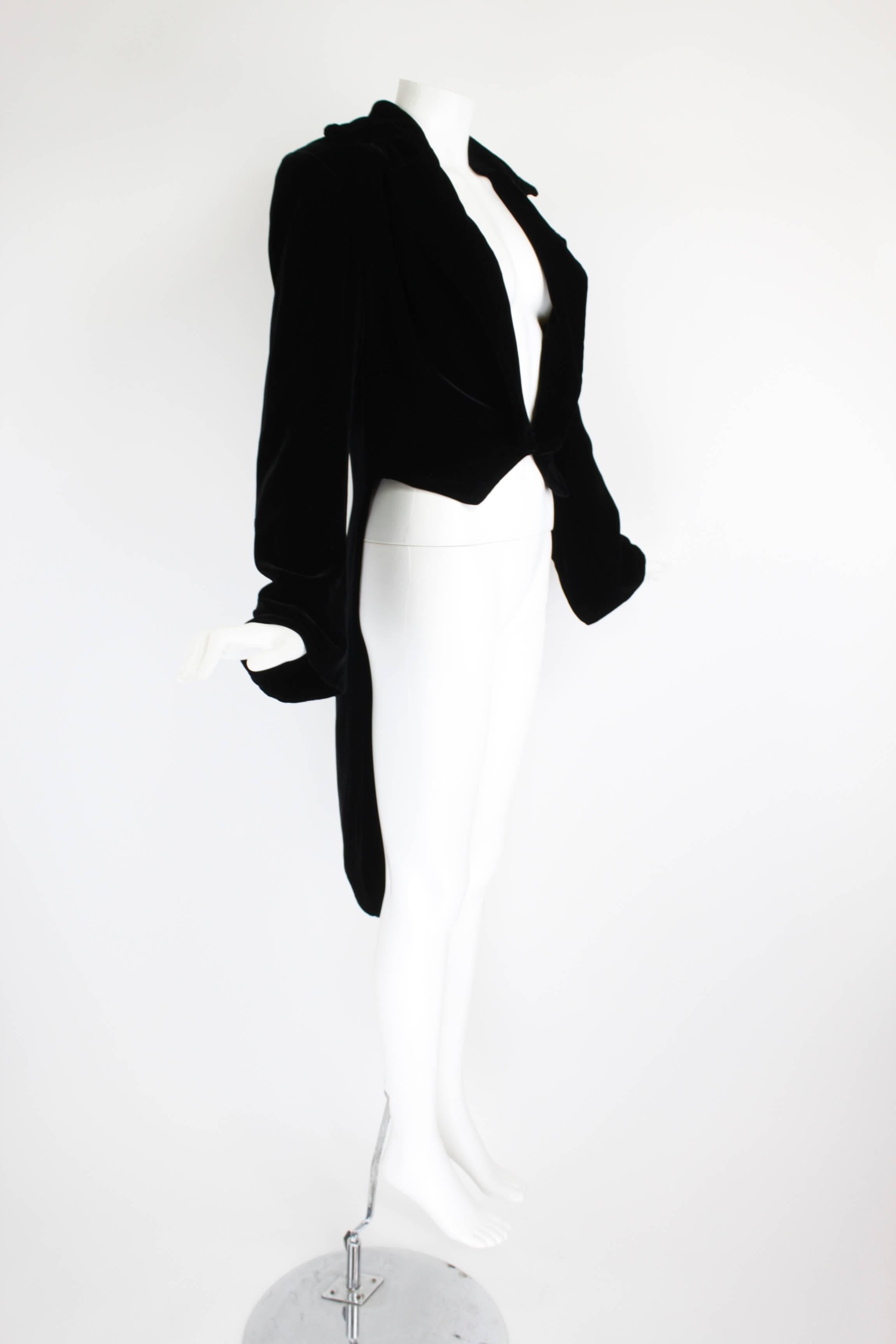 1990s OMO Norma Kamali Black Velvet Tailcoat

Measurements--
Bust: 38 inches
Waist: 34 inches
Length, Shoulder to Shoulder: 18 inches
Length, Shoulder to Cuff: 25 inches
Length, Center back to End of Tail: 44 inches