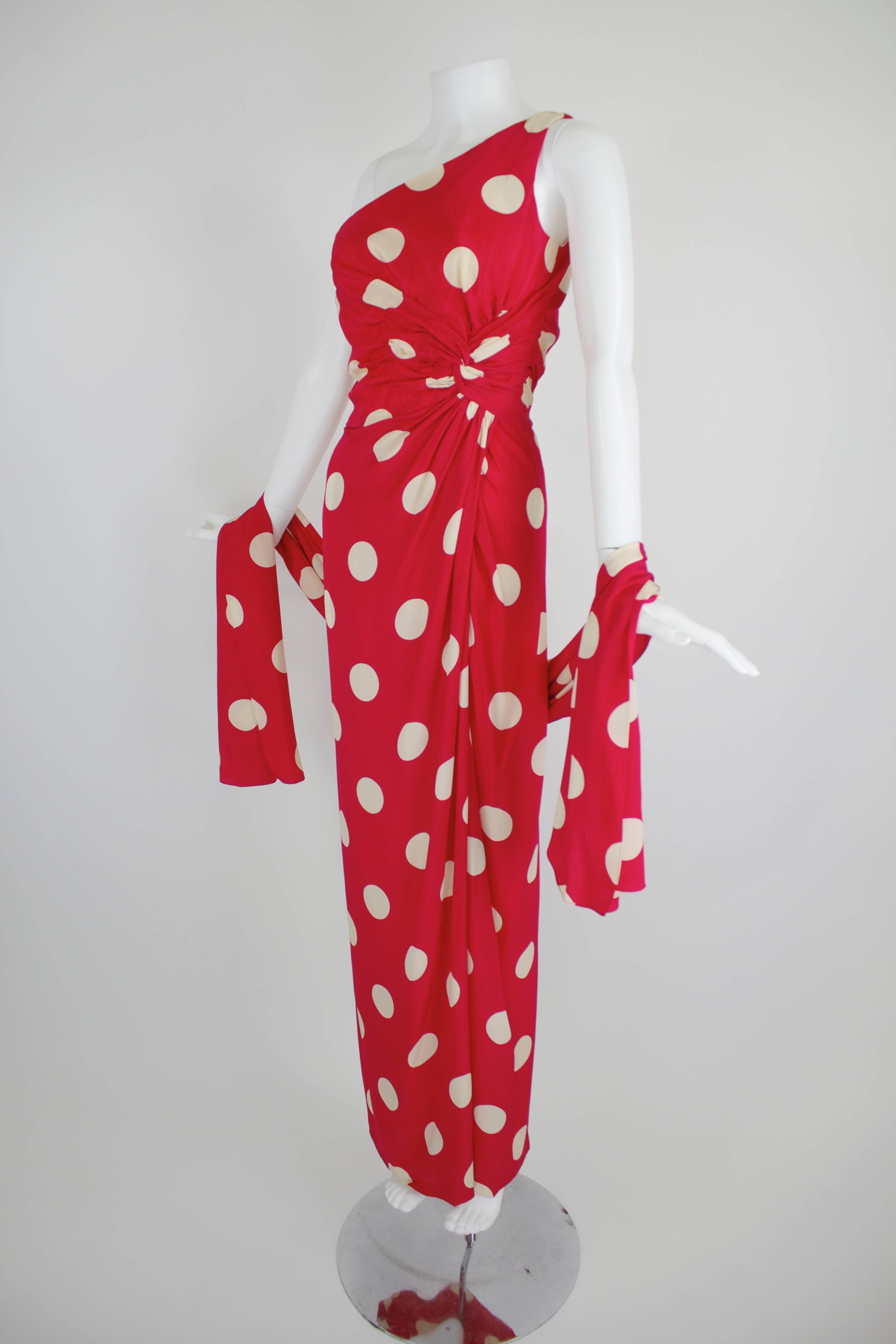 A gorgeous evening gown from Lillie Rubin, done in strikingly beautiful red silk, covered with classic white polka dots, and a matching wrap. Unlined. Side zip.

Measurements--
Bust: up to 36 inches
Waist: up to 27 inches
Hip: up to 36