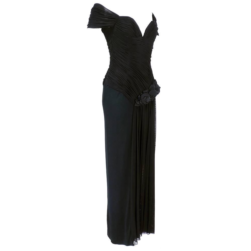 Vicky Tiel Couture gown from the 1980s in black jersey with heavily shirred bodice and cascading swag. beautiful fabric rosettes at hip. Deep V neckline with off the shoulder glamour look. Fully boned bodice. Welcome to sexy town USA!