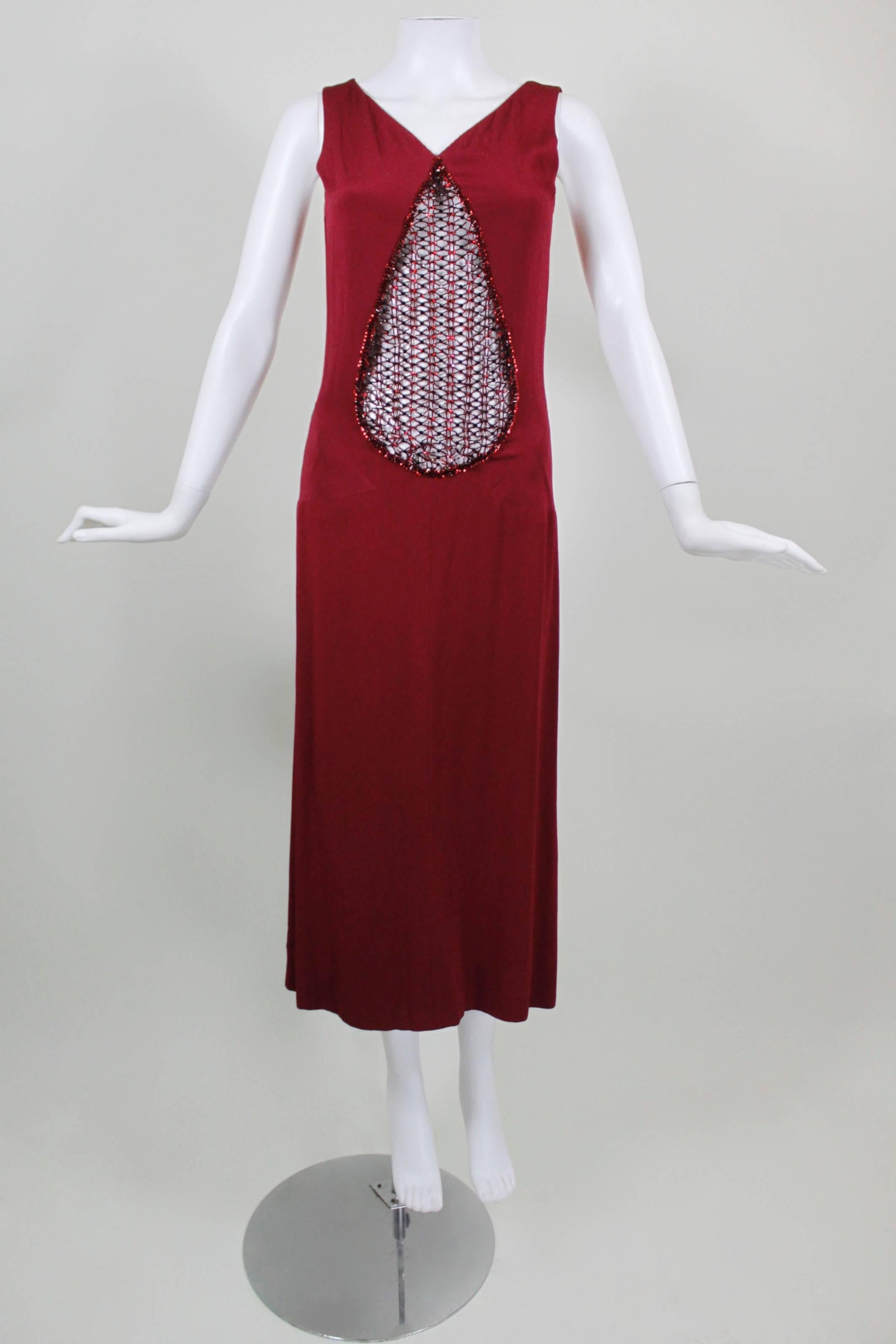 A stunning 1930s-inspired evening gown from Stop Sénès. This couture gown is done in raspberry red silk, is bias cut, and has a stunning drop-cutout covered with rhinestone and glass caged beading. 

-Scoop back
-Zips in