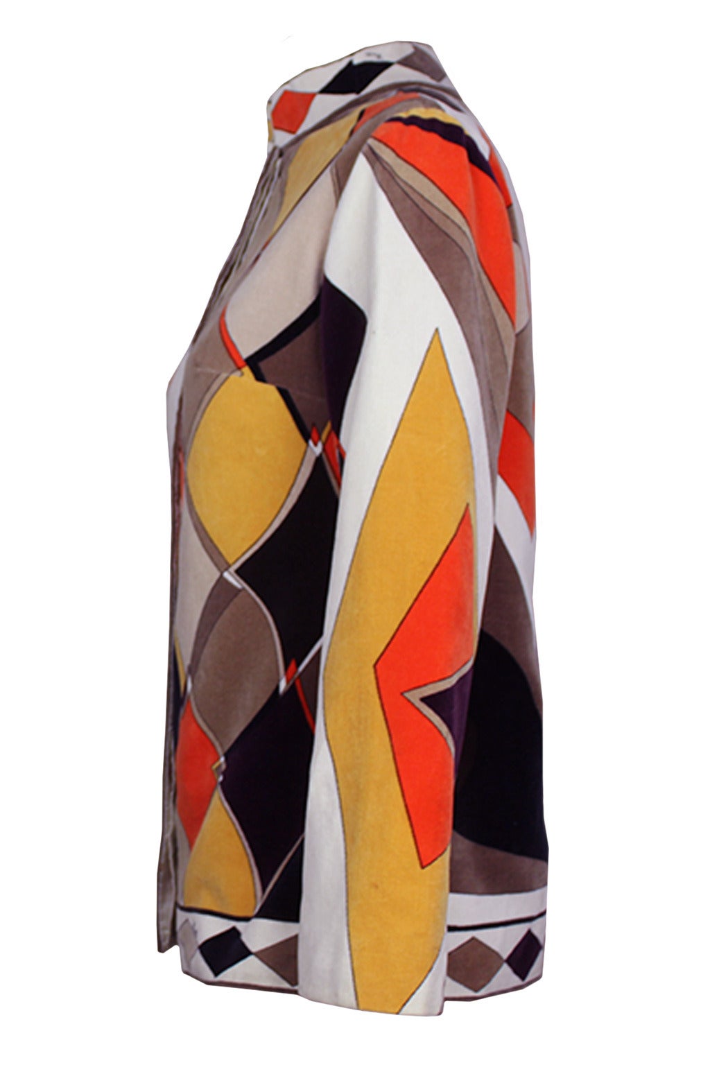This vibrant Emilio Pucci cotton velvet jacket has an iconic late 1960's geometric design with the Pucci signature throughout. It has a Mandarin stand up collar and concealed fastenings. Clear buttons match to button holes on the inner lining of the