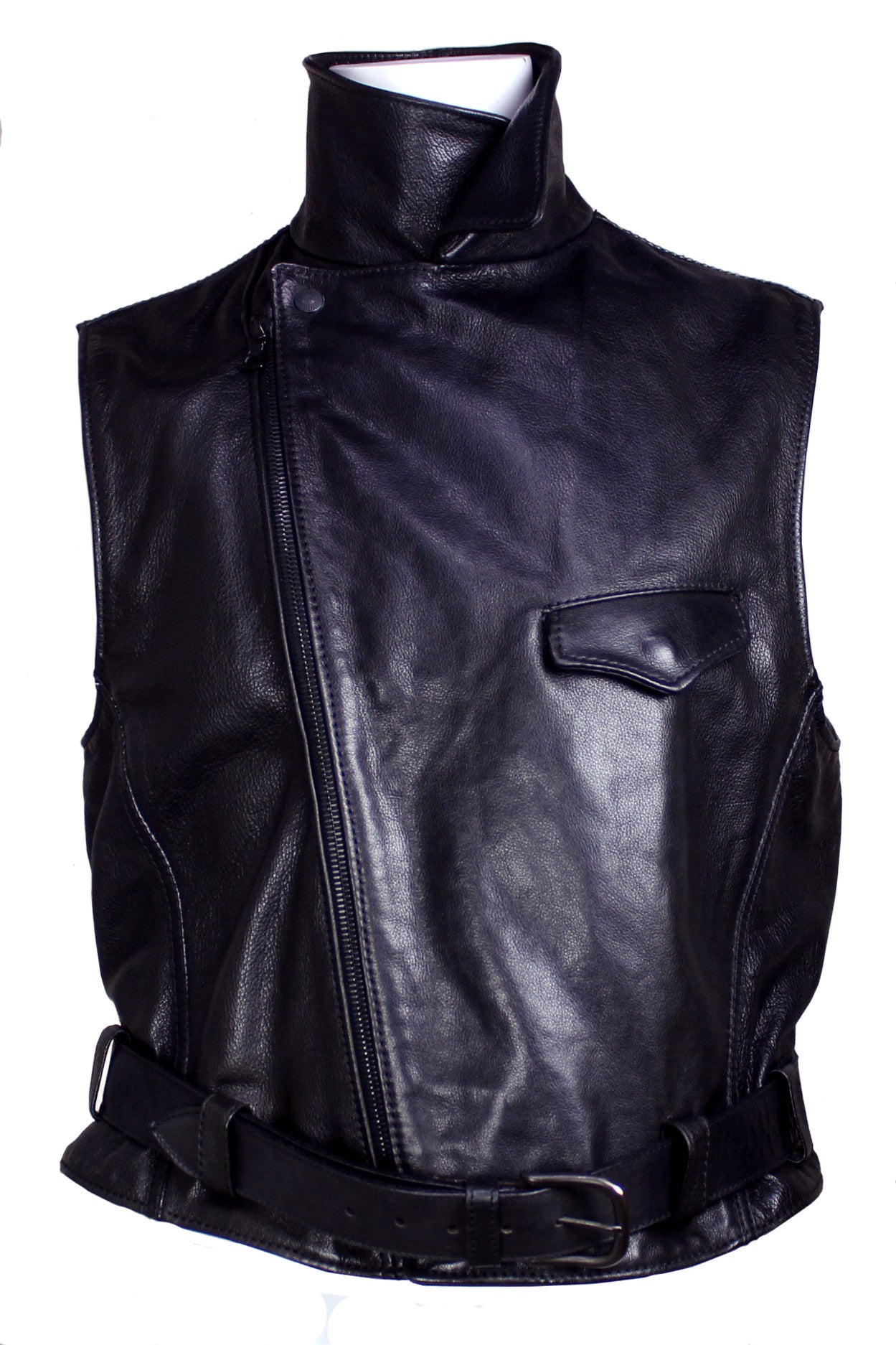 Ruffo has produced leather pieces using the highest quality leather for fashion houses such as Versace, Prada, and Dolce & Gabbana. This sleeveless motorcycle vest is a classic design with a zip up front breast patch pocket and belted waist.