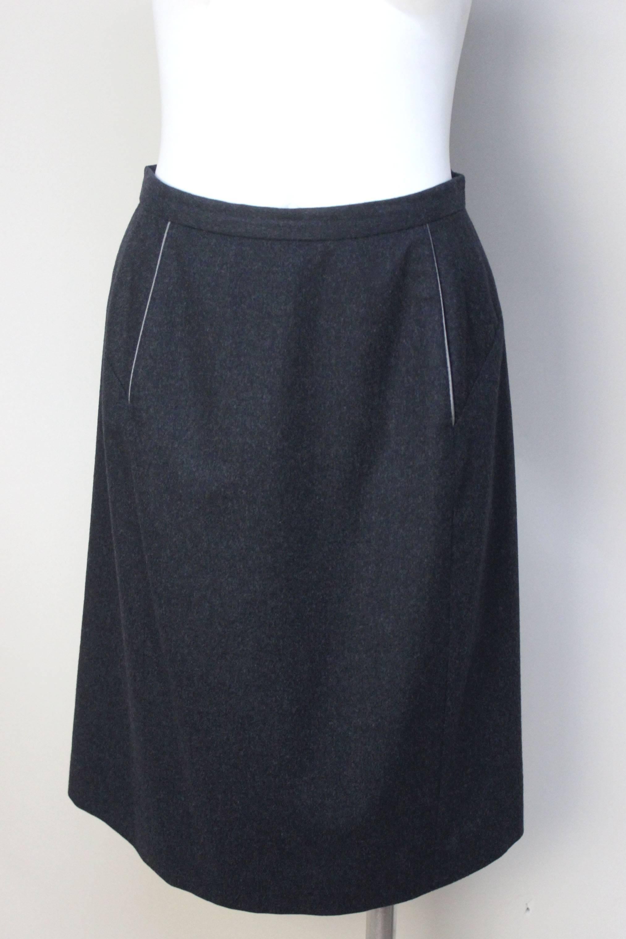 Isabel Toledo is considered American fashion royalty. Her designs are beautifully crafted. This skirt is simple in shape but perfectly designed. Made of a fine tropical wool, this skirt is slightly a-line with two back slits. It is completely lined