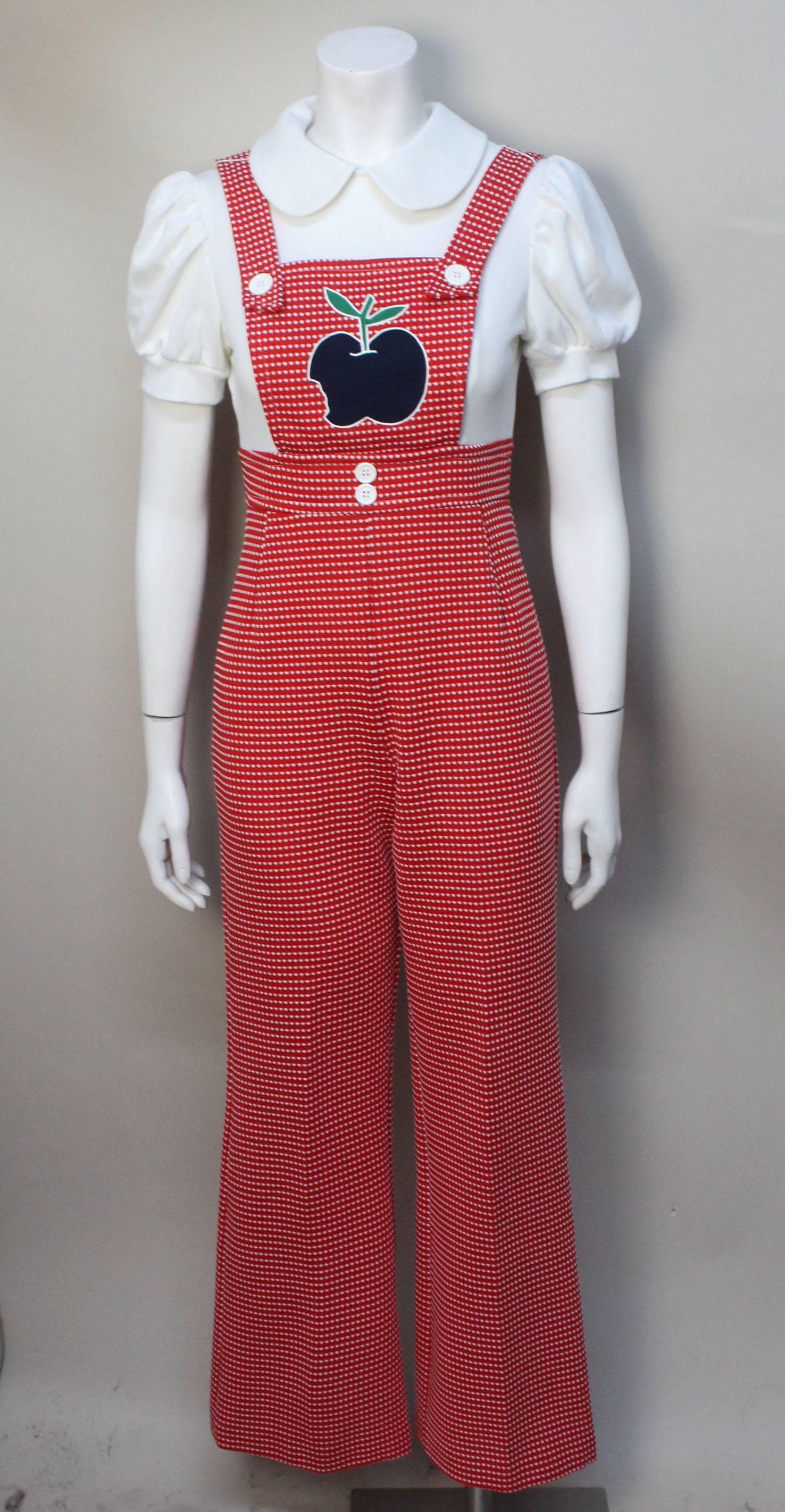 This jumpsuit is an authentic mod garment from the 1960's. The label reads "Styled by That Girl", manufactured in Miami, Indiana. The design of this garment was definitely inspired by Carnaby St fashion. At first glance, the jumpsuit