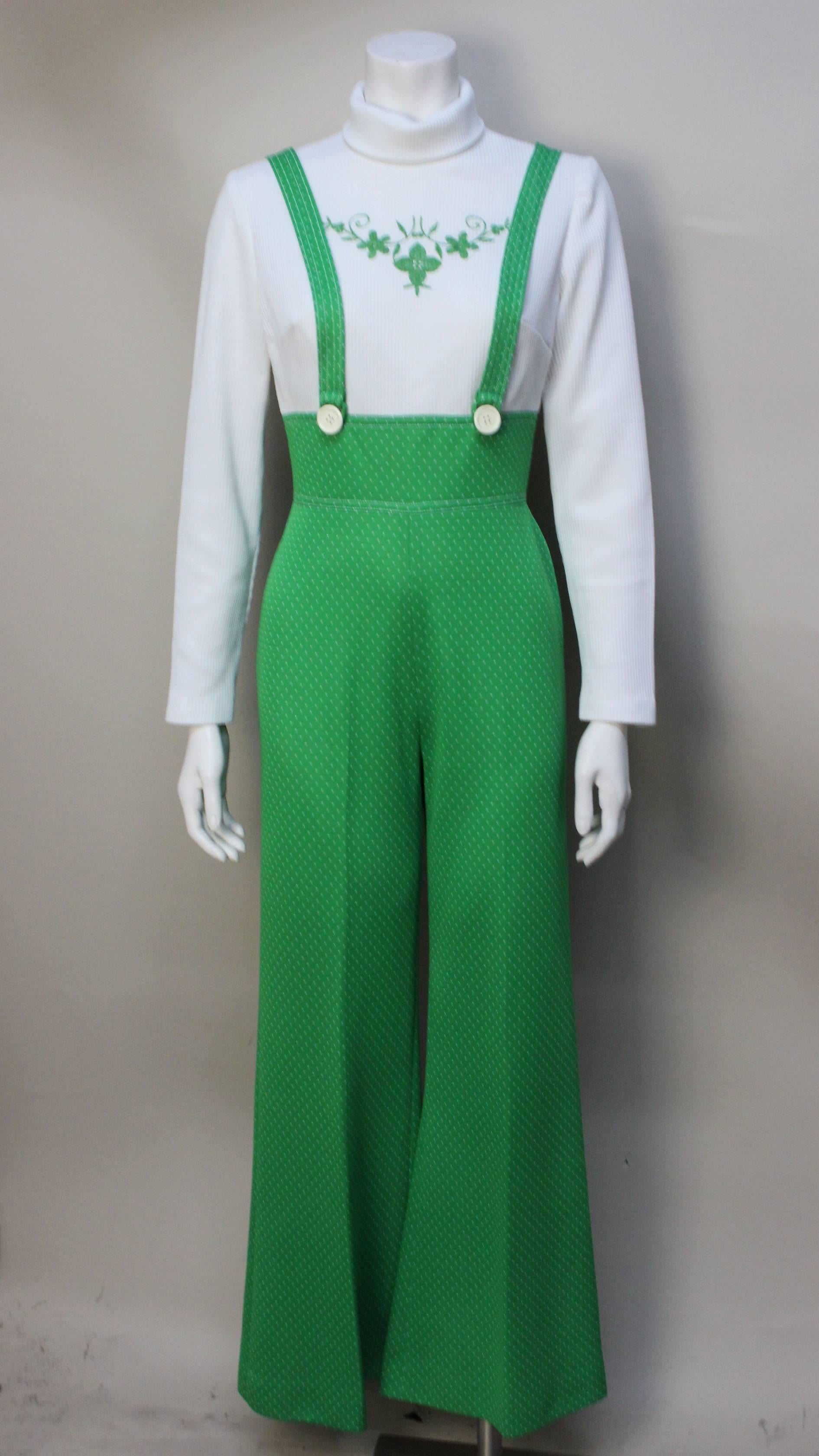 Jerell of Texas was a manufacturer of stylish clothing for juniors in the 60's and 70's. The design of this jumpsuit was based on mod styles coming out of London in the late 1960's. The one piece jumpsuit resembles a two piece overall with a moch