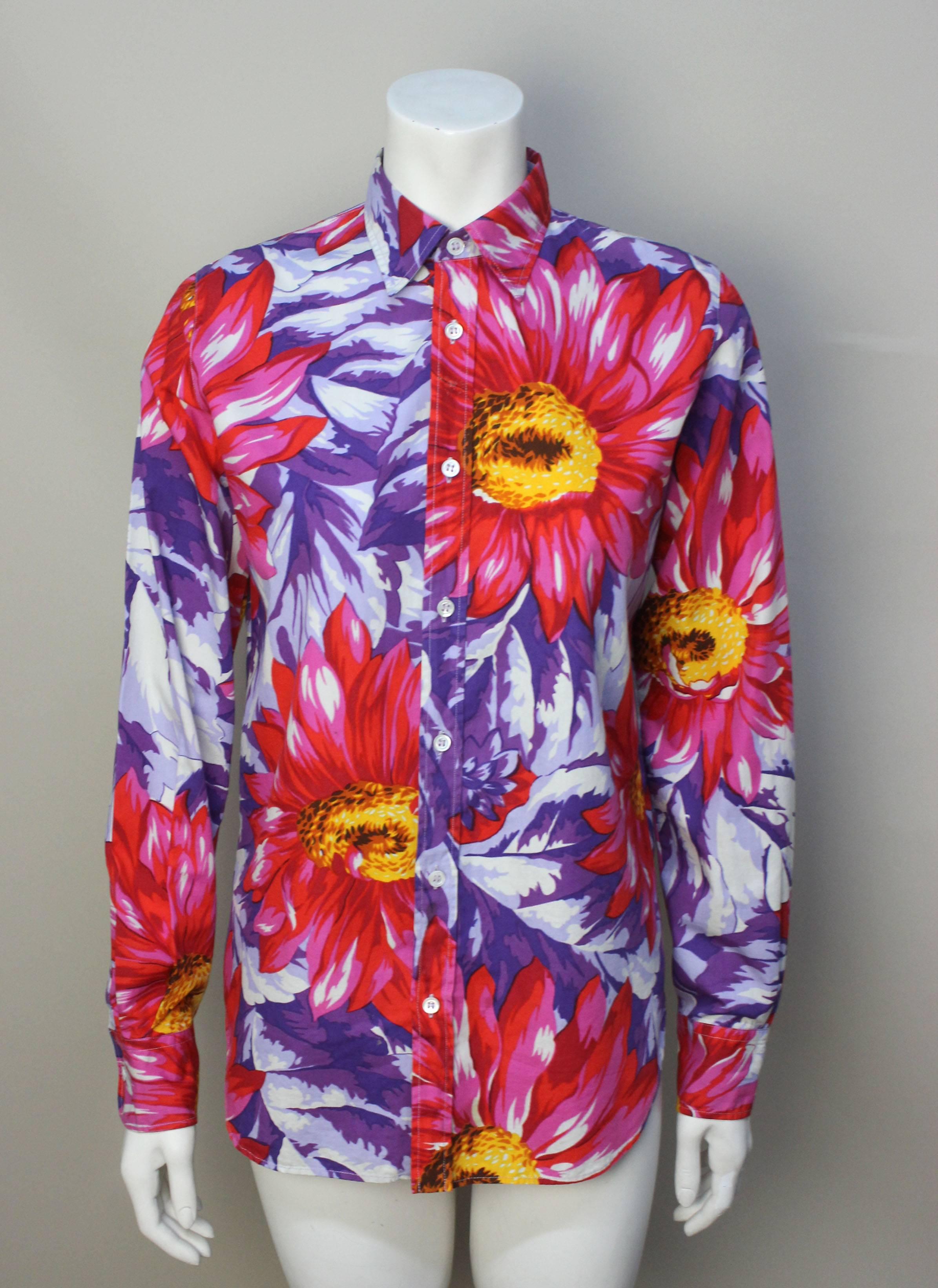 The pattern on this blouse is a bold and colorful floral. Large flowers are spashed across the garment in a painterly effect. The style is a classic button down, however the print makes it a standout piece. 