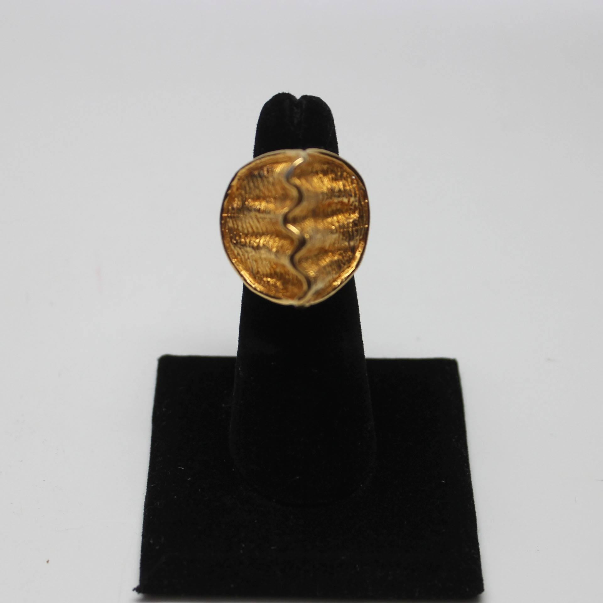 This Kenneth J Lane is unusual in that it is more abstract and sculptural than most of his jewelry. It's a striking, bold piece as it extends high over the finger in an almost architetual style. Size 6.