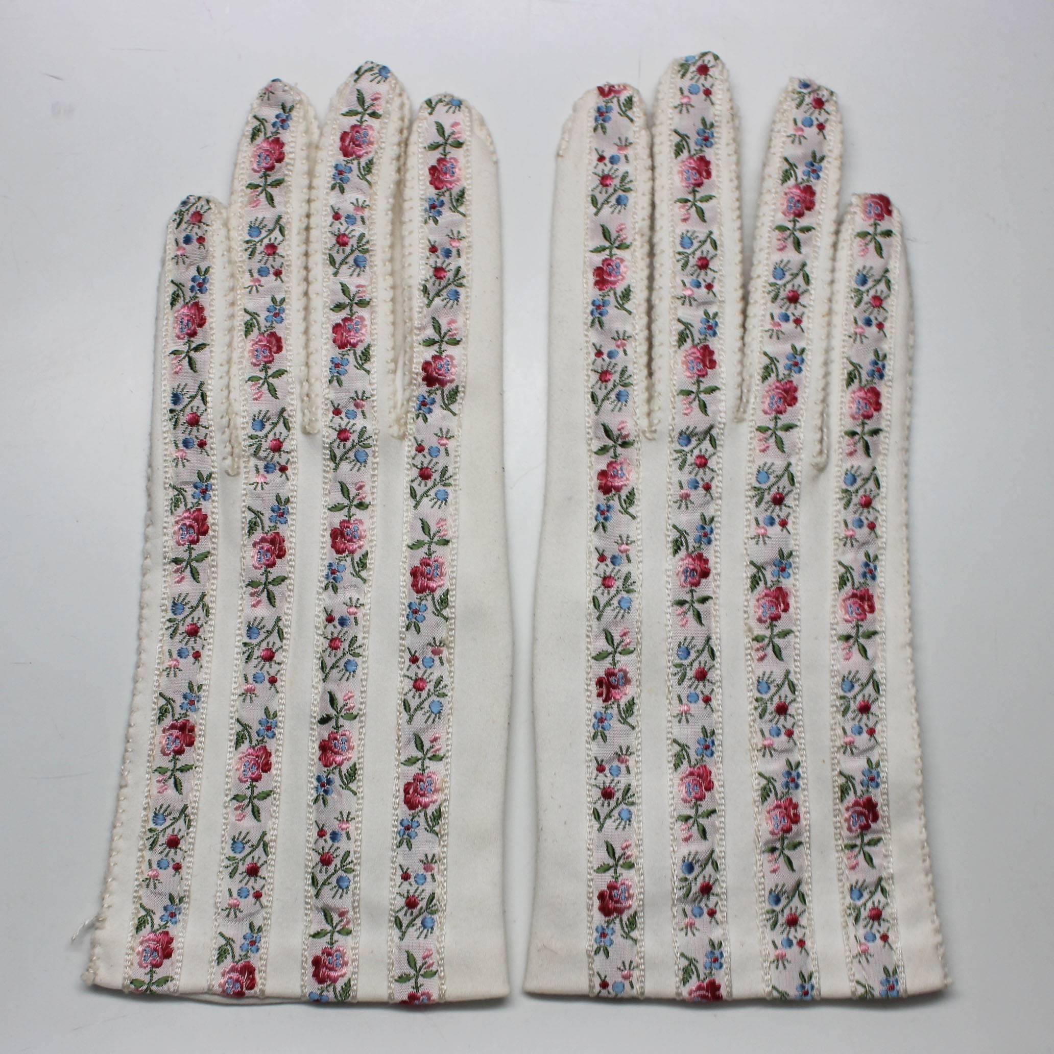 Ombre red/pink and blue/green floral ribbon stitched onto delicate creme cotton gloves. Each finger is hand stitched
Approximate size 6