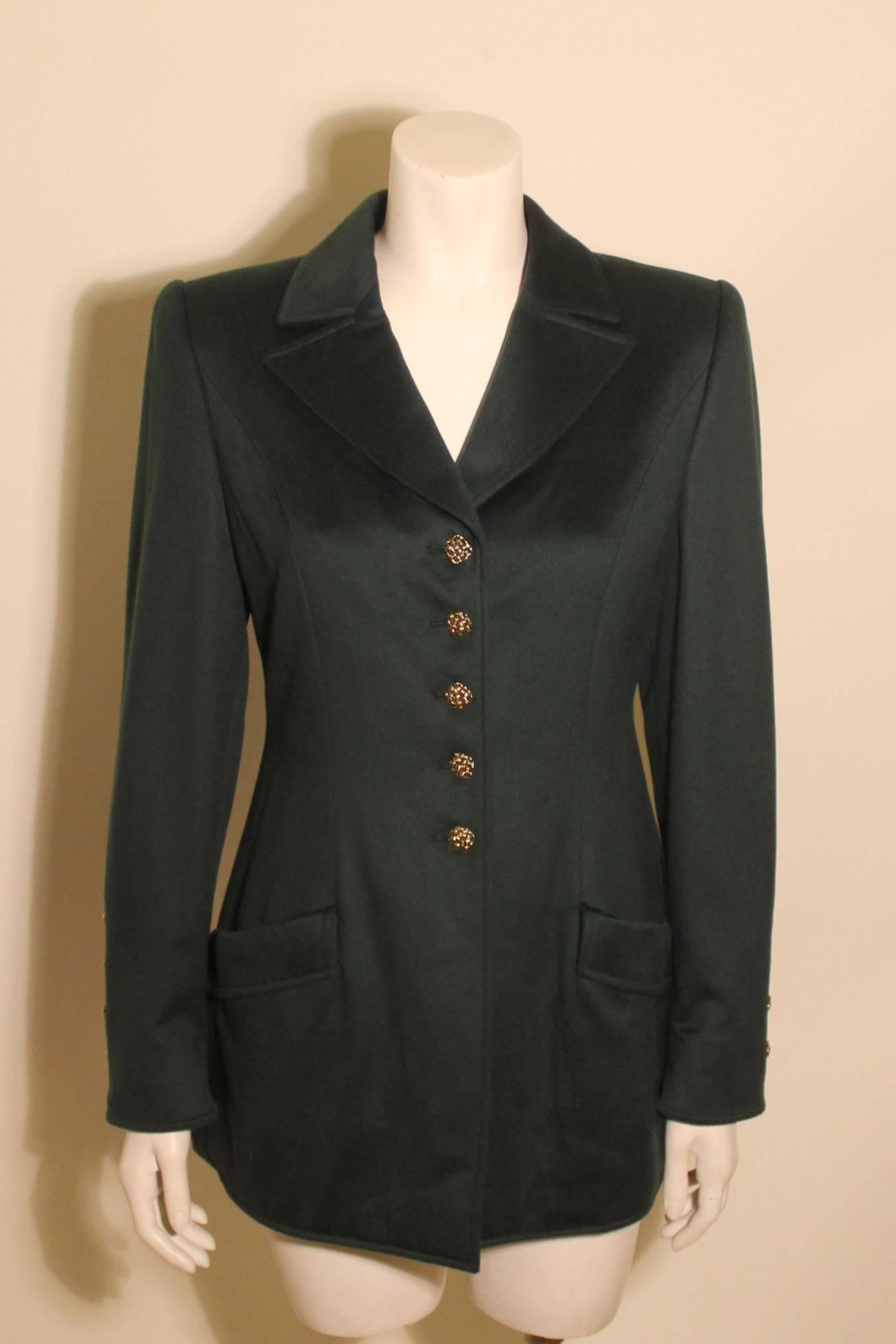Luxe forest green cashmere jacket from Valentino with gold tone basket weave style metal buttons on the front & cuffs. There are two pockets at the hip.