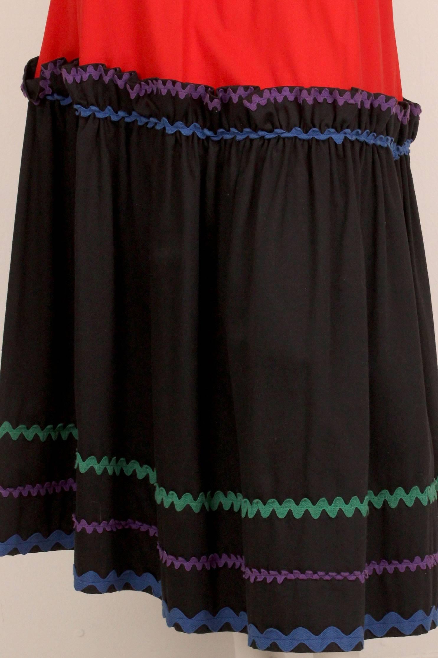Special Sale $498 Originally $795
This skirt is from the Yves Saint Laurent Rive Gauche collections of the mid to late 1970s when he drew on ethnic themes for his inspiration.  This skirt is in a peasant style with  two tiers of fabric and bold ric