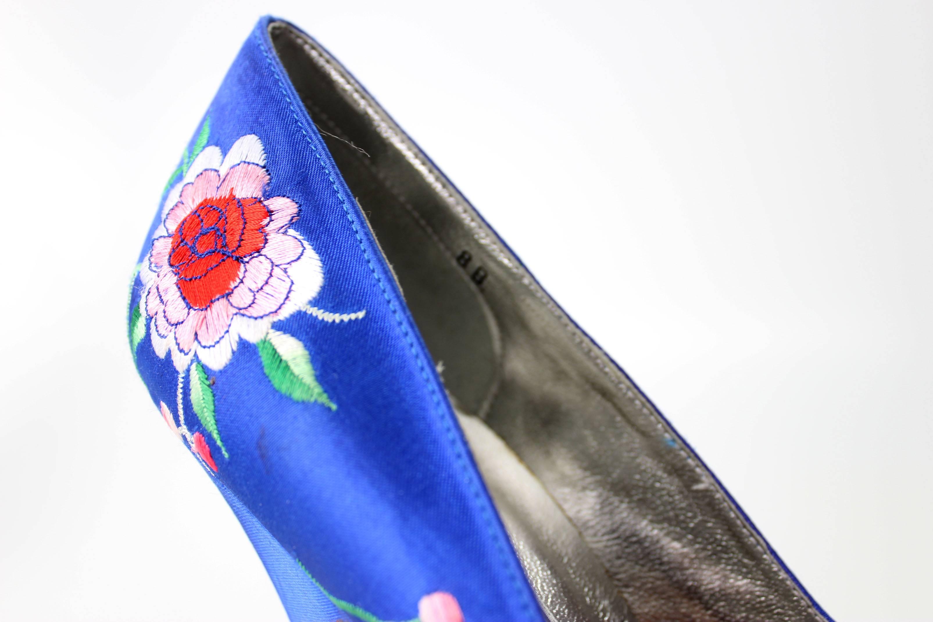 These never worn vintage Norma Kamali pumps are outstanding. The delicate embroidery on the rich blue satin background is in an intricate floral motif.  The style is a timeless pump which is as relevant to fashion today as when they were created in
