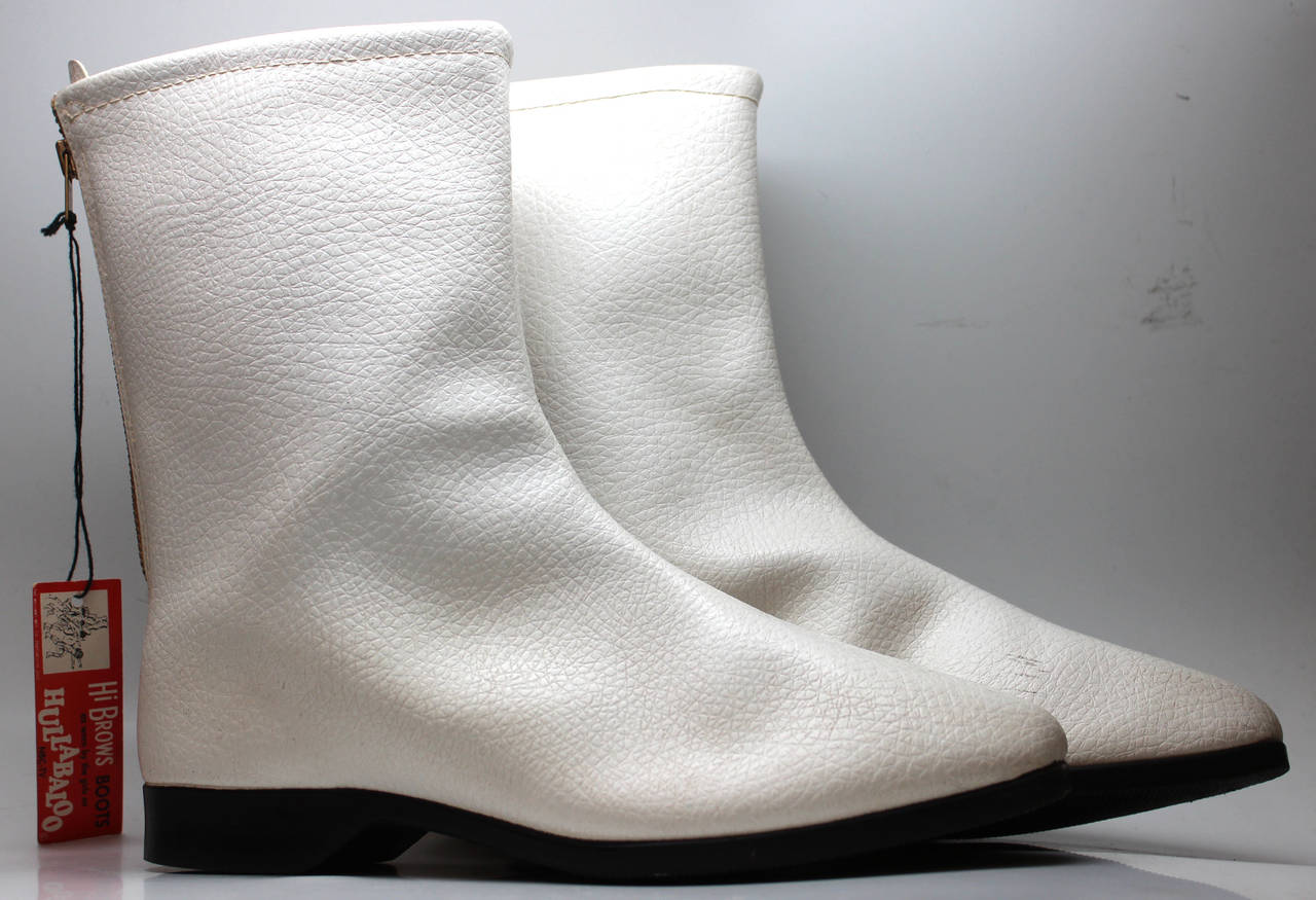 Go go boots were introduced in the mid 1960s. The original style was
white, low heeled and below the calf in height. The style was called
the Courreges after the designer who was the first to show them and
spurred their popularity. They achieved