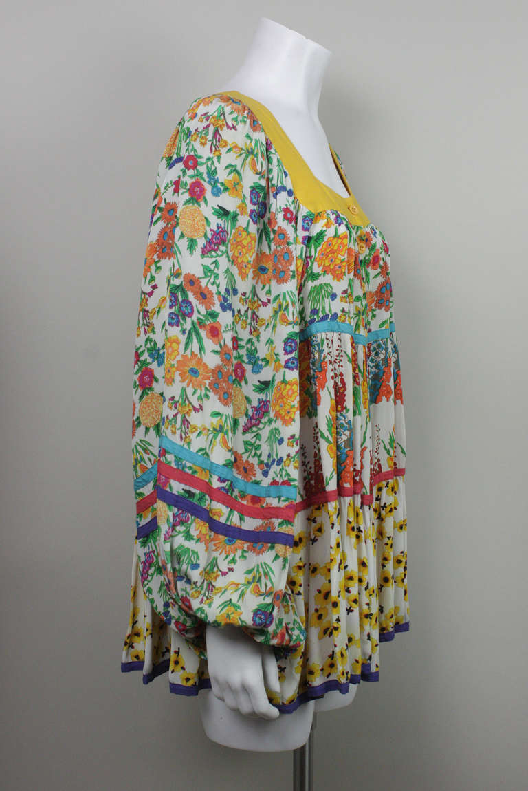 Amazing 1960s mini dress in a multi floral print. Button down front and billowing sleeves. 

A contemporary of Ossie Clark, Jeff Banks' airy and bright designs were a Carnaby Street style staple.