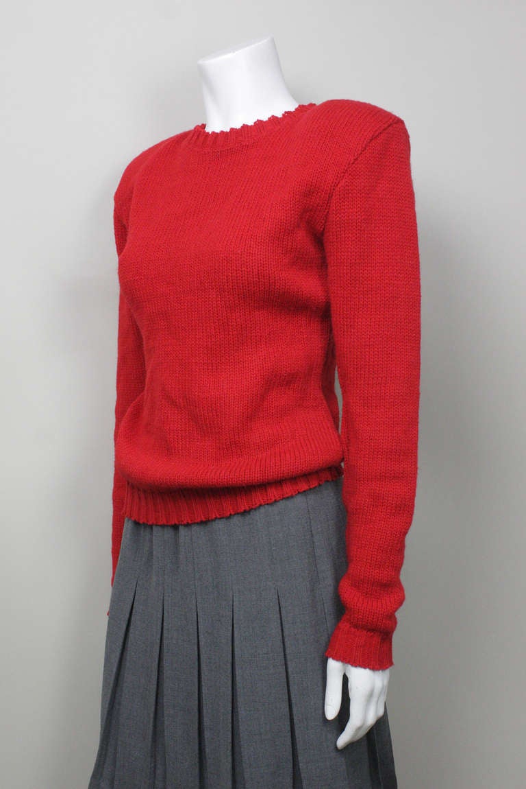 Now on sale! Original price $299

Red acrylic and wool sweater with shoulder pads and a dramatic open back. From Betsey Johnson's punk label.