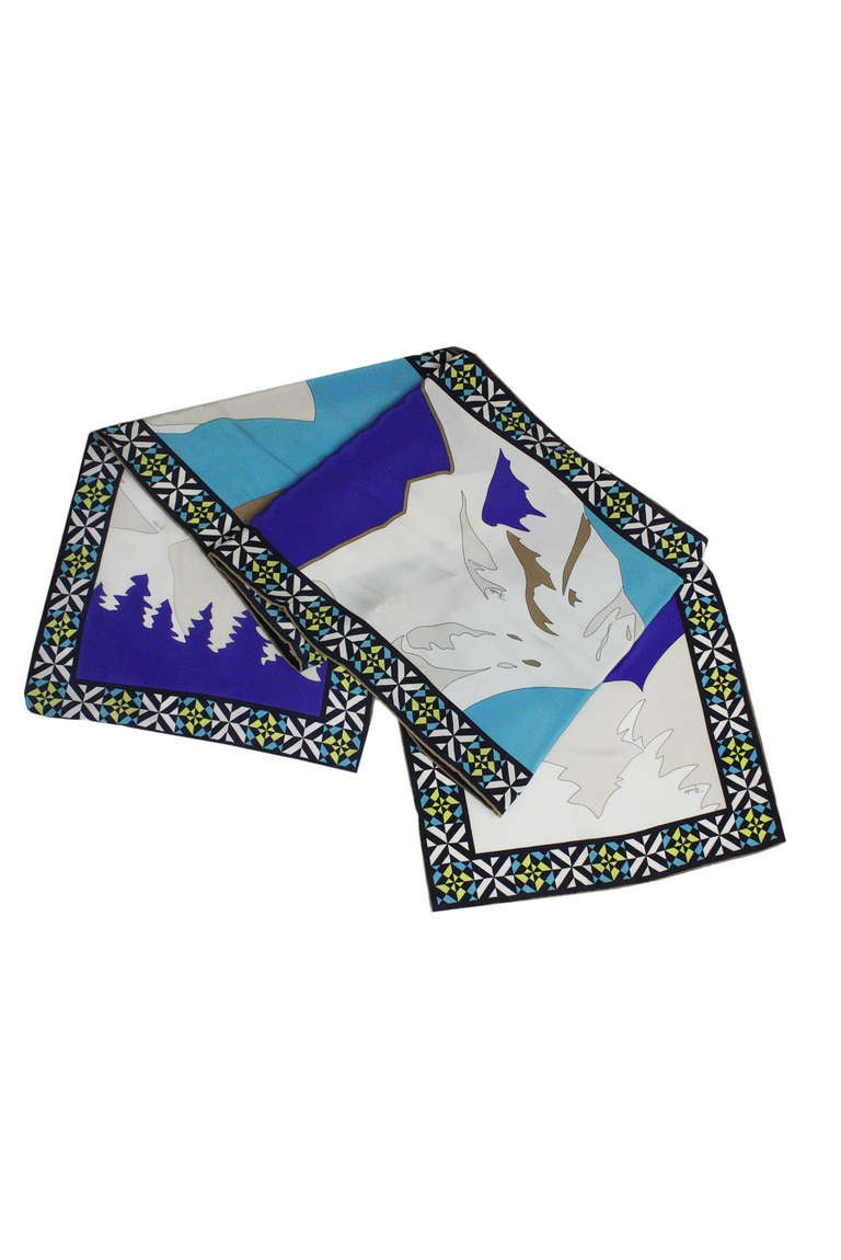 Long silk scarf with a gorgeous mountain and tree print. Geometric border.