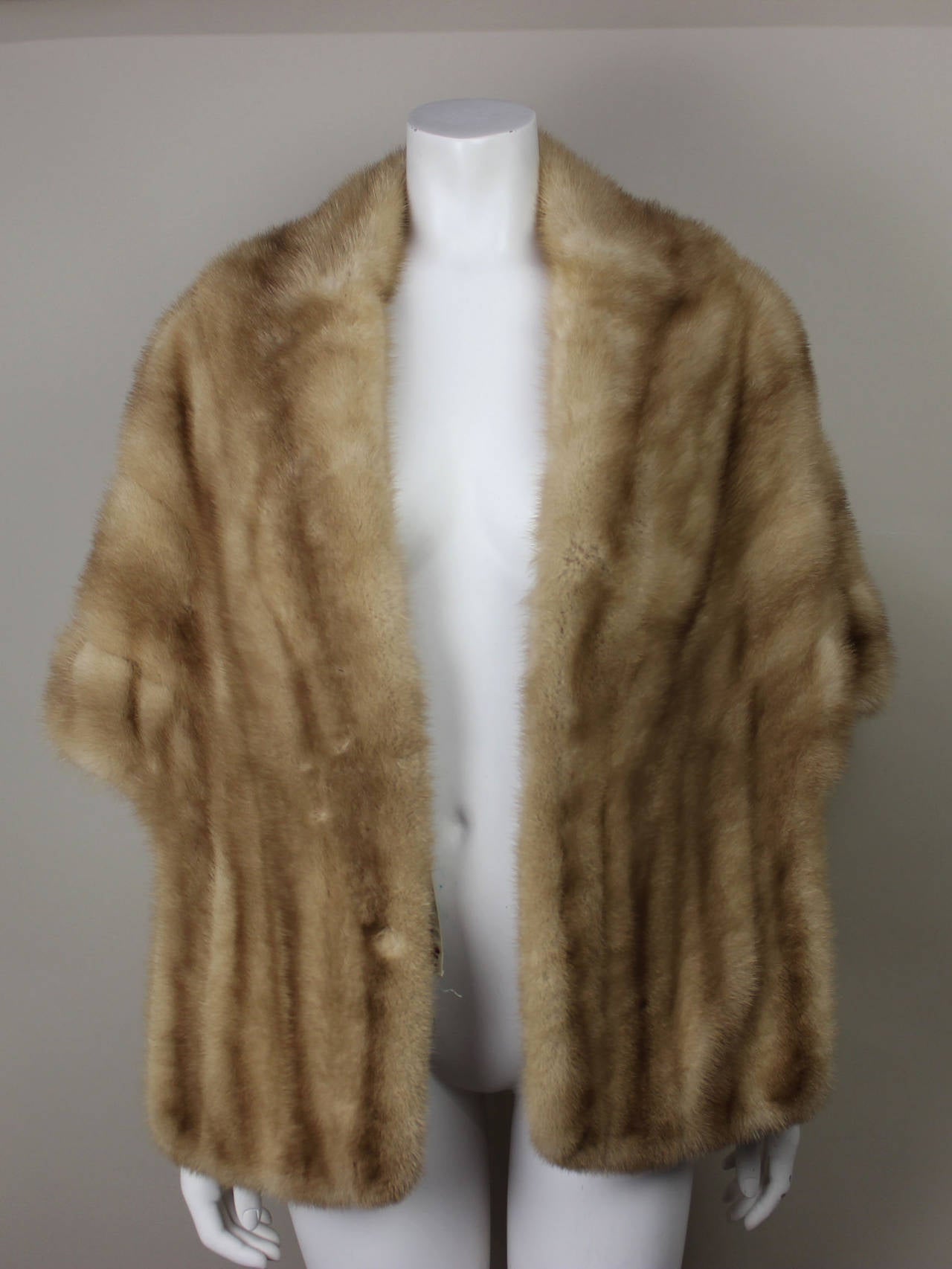 SALE! Originally $795
This Schiaparelli stole drapes beautifully; the fur is supple and in perfect condition. The silk lining is stitched with the Schiaparelli name and sewing needle logo.  Although in the 1950's it was worn as a topper, it looks