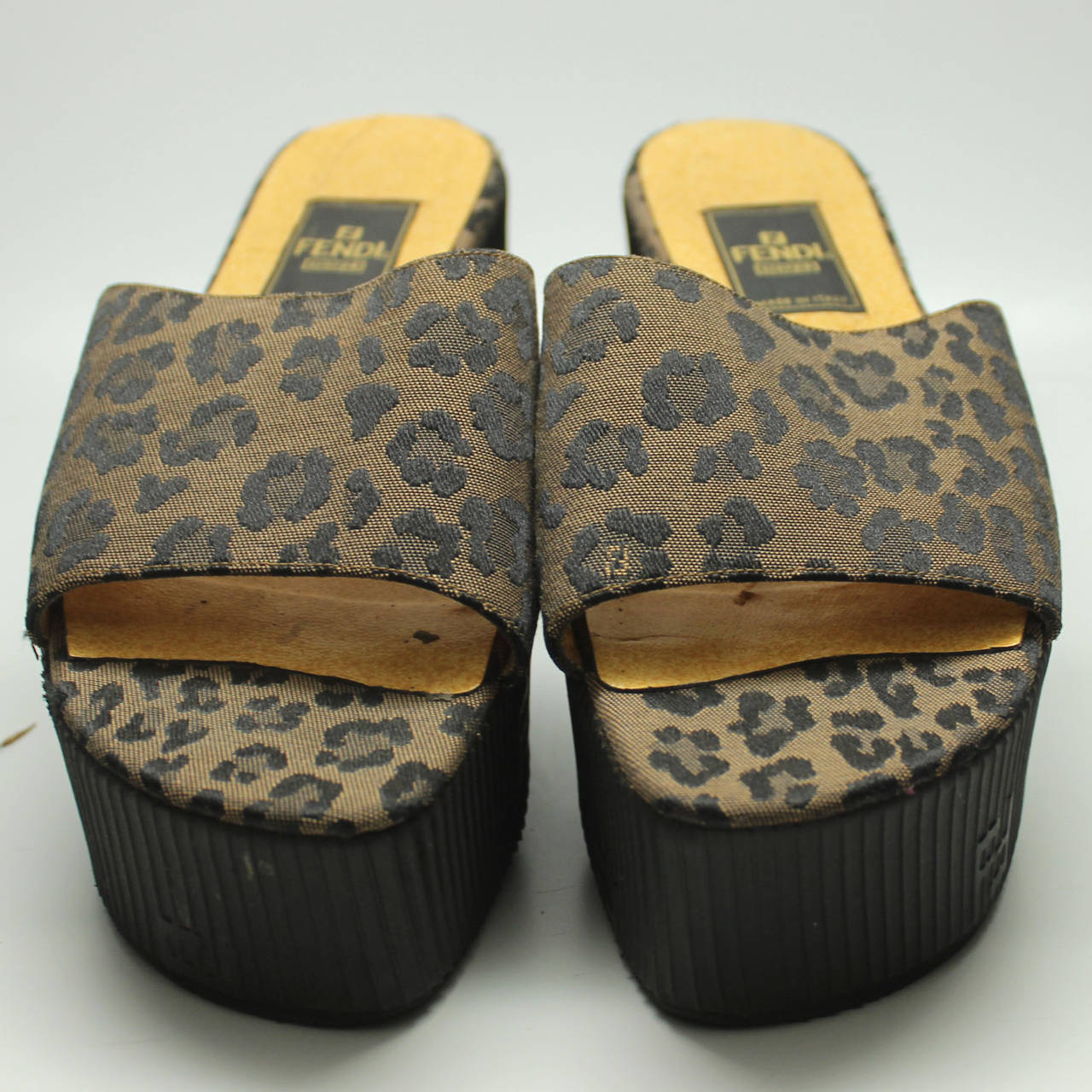 These leopard print slides are the perfect, chic sandal for summer! A band of leopard fabric backed with leather sits atop a black rubber ribbed sole.