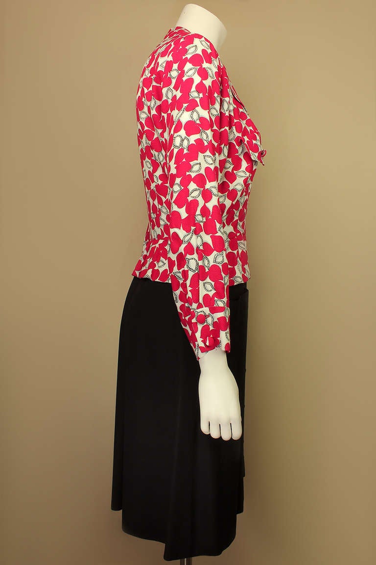 Now on sale! Original price $245

This dress has wonderful design details, with a printed peplum top which appears to be a separate piece but is attached to a button down skirt with deep front pockets. The style is way reminiscent of a 1940's