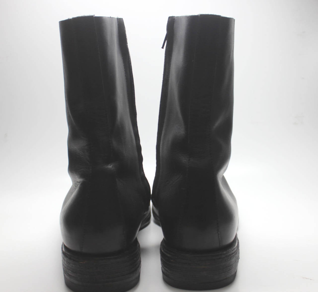 These boots dating from the 1990's have the label of Line 10, which is the mens equivalent of Line 1 in Margiela's design timeline. They are a classic chelsea boot with a side zip and square toe.