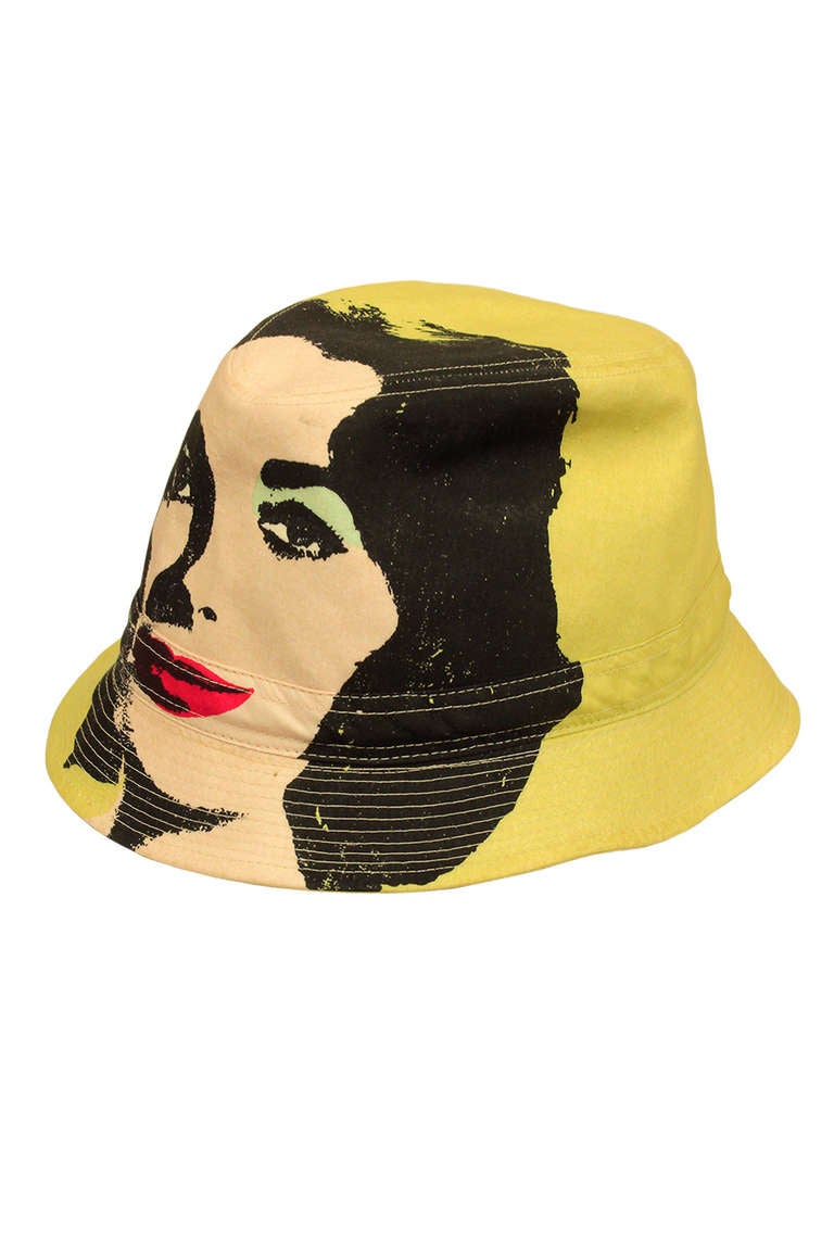 In the early 2000s, Treacy did a tribute to Andy Warhol with a line of celebrity-themed hats. This one features Elizabeth Taylor. It is a wonderful vintage collective item.