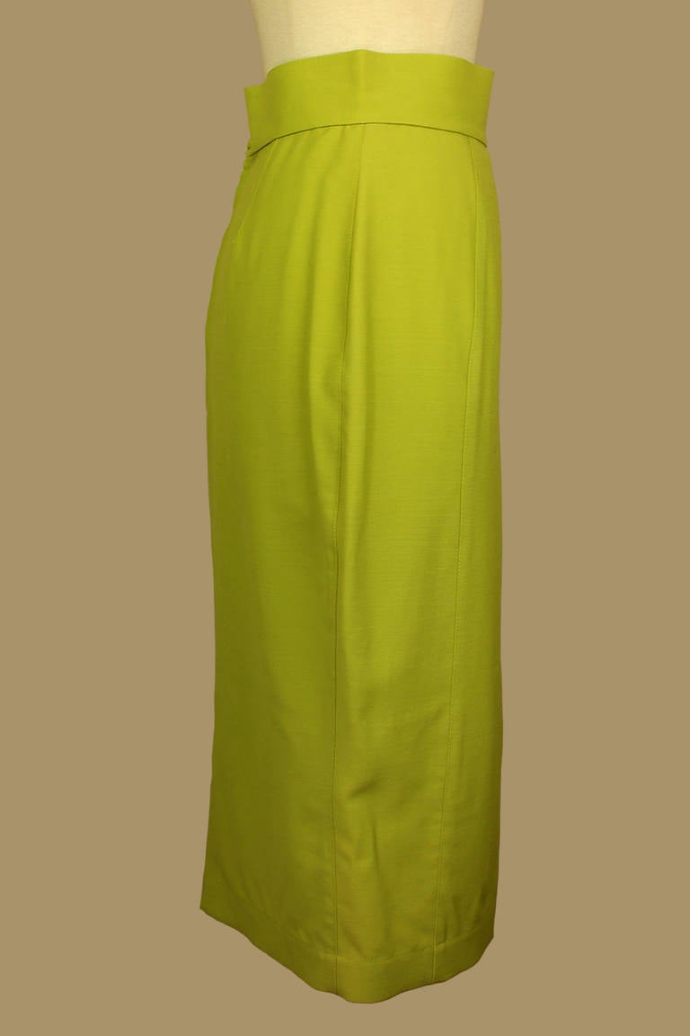 Originally $300!!
Thierry Mugler is influenced by the glamour of the past with a hint of 1940's Hollywood but with a harder edge. This Thierry Mugler pencil skirt is in an appealing lime green with a small slit at the bottom back and an interesting