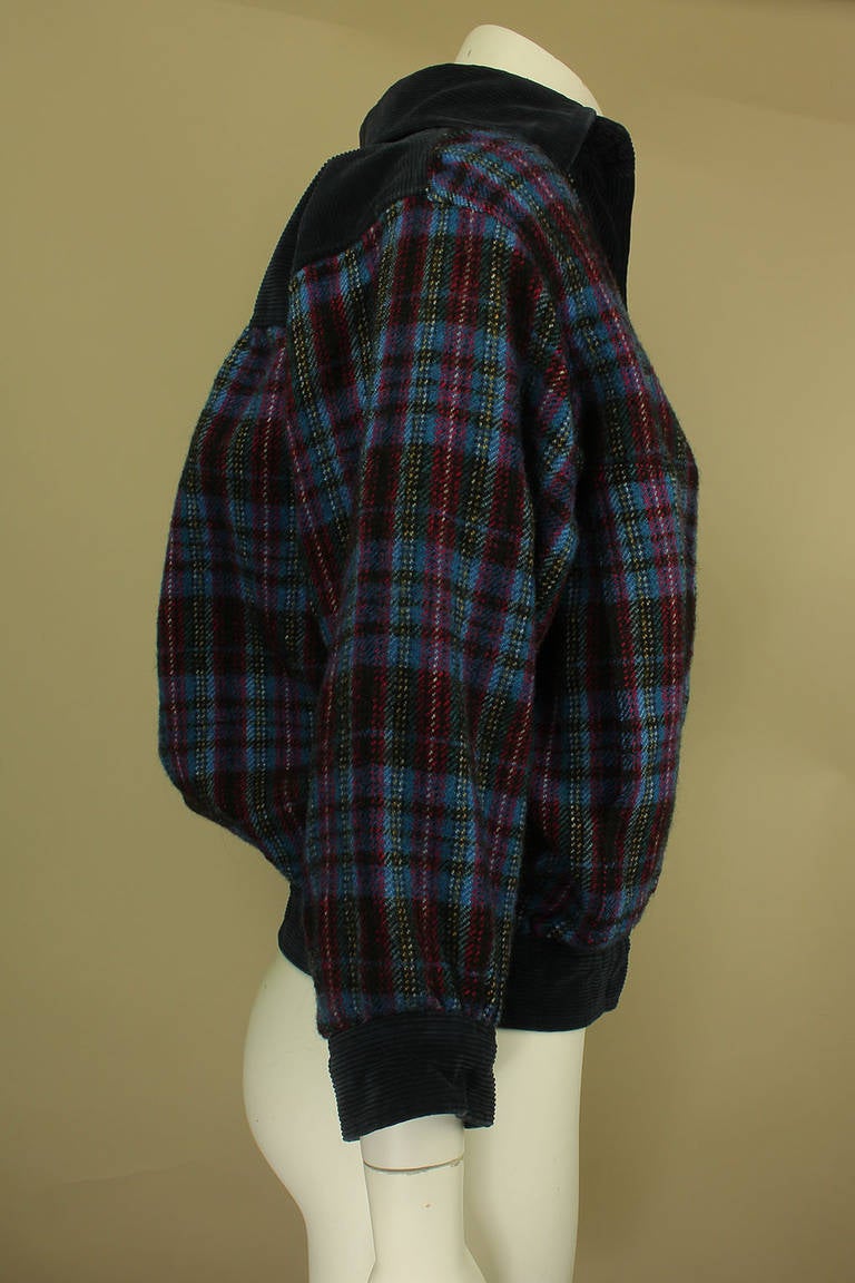 Now on sale! Original Price $425

This 1970's blouson jacket is cropped at the waist with a plaid wool body and corduroy trim. The sleeves are 3/4 length which adds to the casual yet chic style.