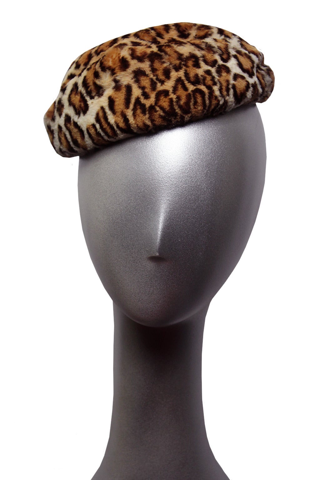 This classic 1940's set includes a hat, long collar and clutch. The extremely soft, short, genuine fur sports an iconic leopard print.  These pieces, worn separately or together, epitomize 1940's glamour.

The clutch is 10.5