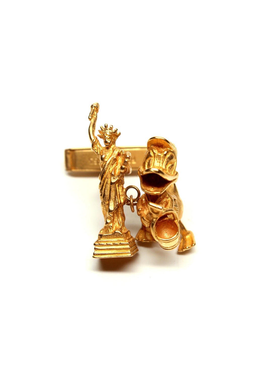 In the early 80's, Tom Binns designed a collection using vintage Chim charms arranged in amusing and eccentric pairings. These unusual and original cuff links make a perfect holiday gift.