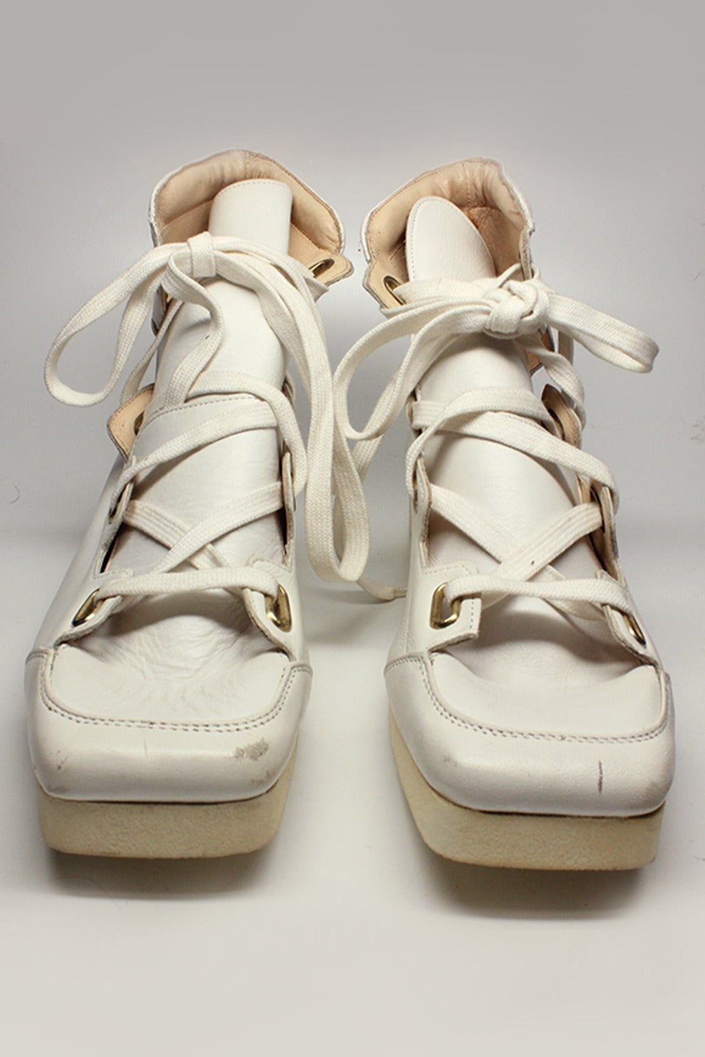 These World's End sneakers are in white leather with a triple tongue and gold rectangular eyelets. They are a reissue made in the late 80's from the iconic Witches Collection of the early 80's.