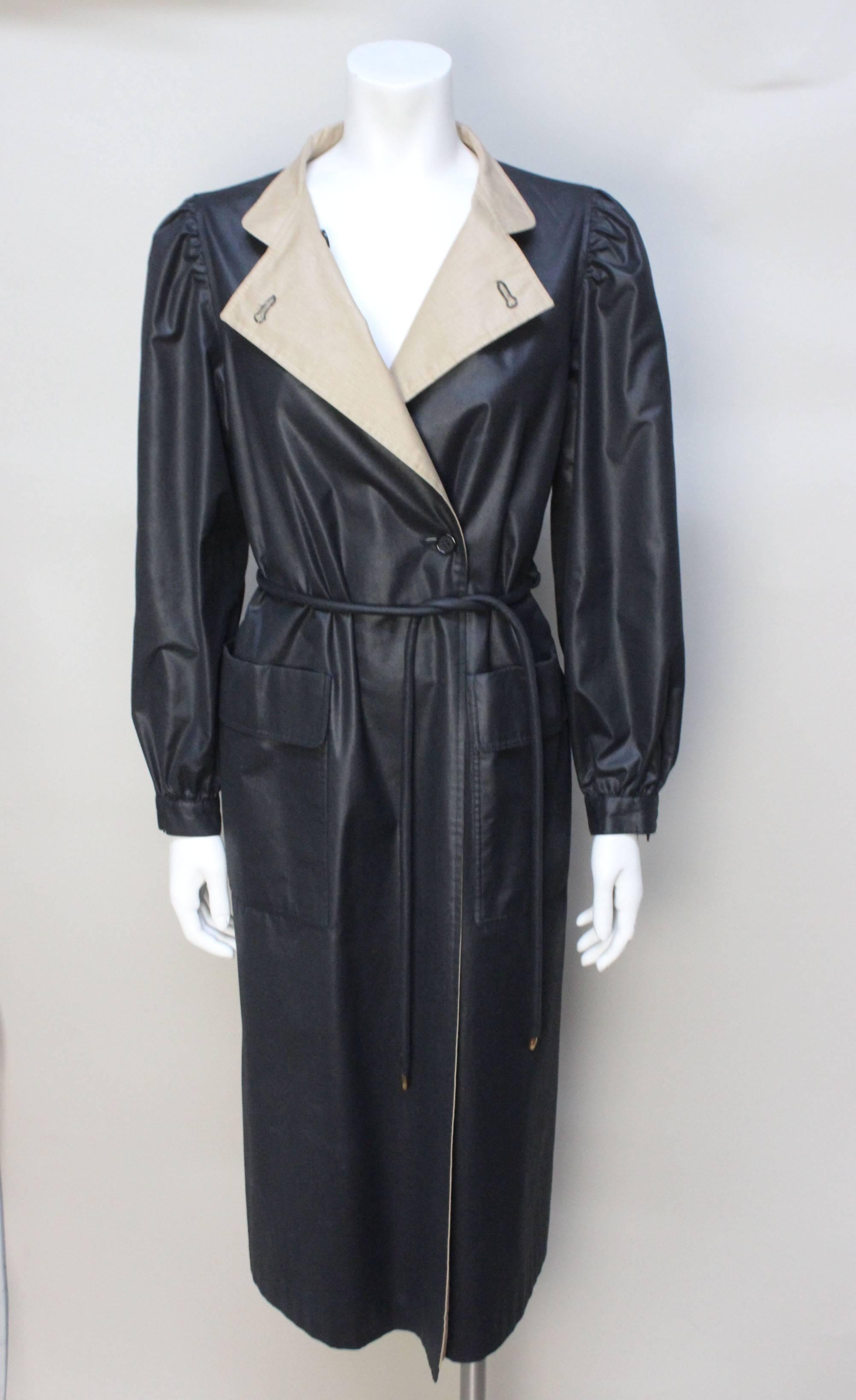 Bonnie Cashin is considered one of the most significant pioneers of American designer sportswear. This stunning jacket is an example of Bonnie Cashin at her finest. This rain jacket, designed for Russ Taylor, is a stunning black jacket with a tie