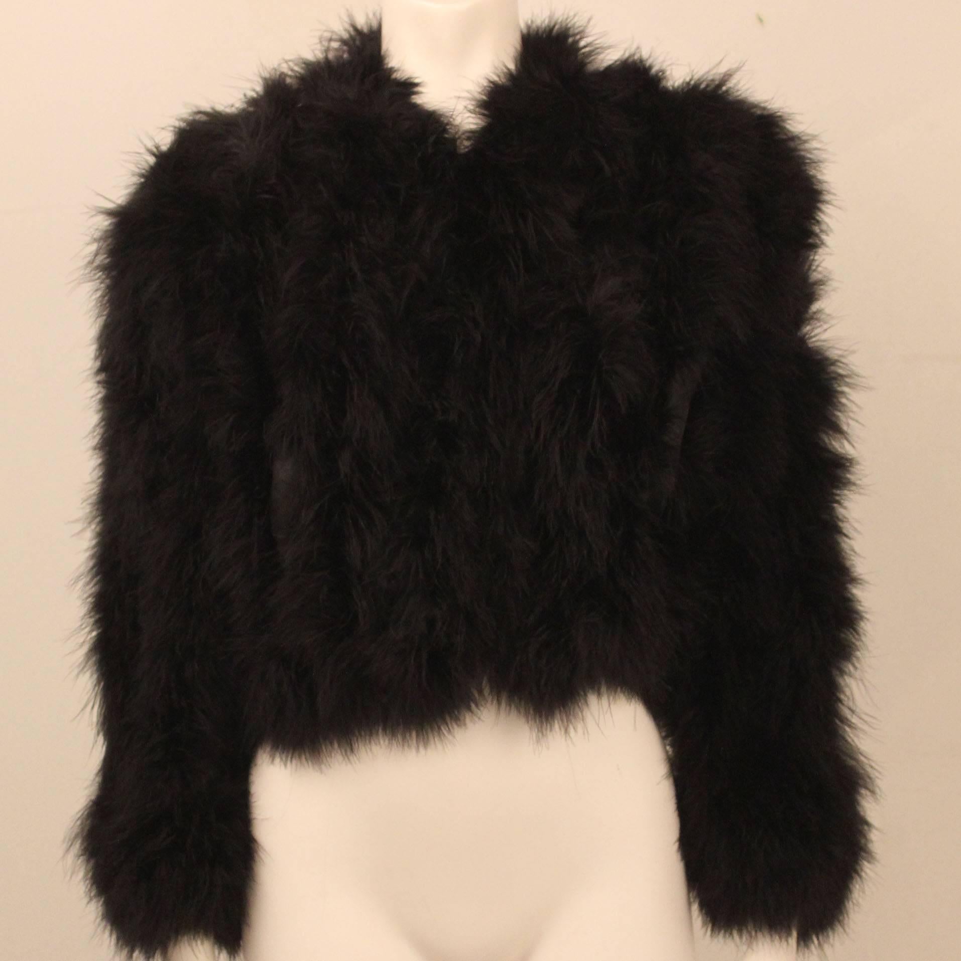 In impeccable, never worn condition-this cropped marabou jacket is an iconic piece of 1970s fashion history. Also known as a 