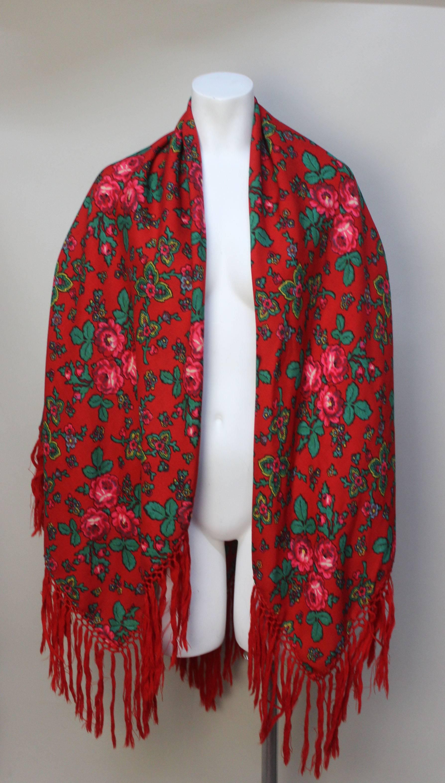 Floral challis shawls have been produced in Russia since the mid 1800s. They became a very popular accessory in the 1970's when folkloric patterns and clothing were all the rage. They are ust as relevant now as they were then. This shawl has vibrant