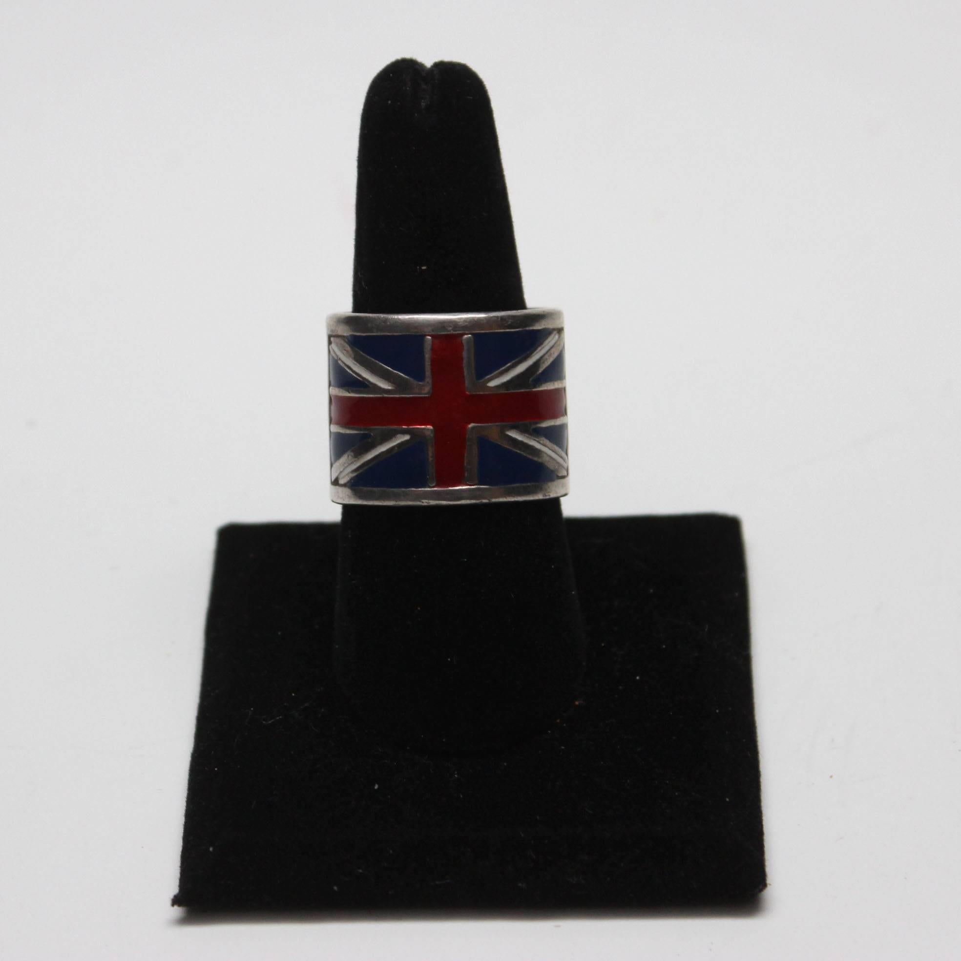 Hal Ludacer was a well known jewelry designer in the 1980's known for his unusual hand crafted jewelry with a rock and roll sensibility. This hevy weight solid silver ring has an enameled union jack on the front half of it. It is a mens size 10.5.