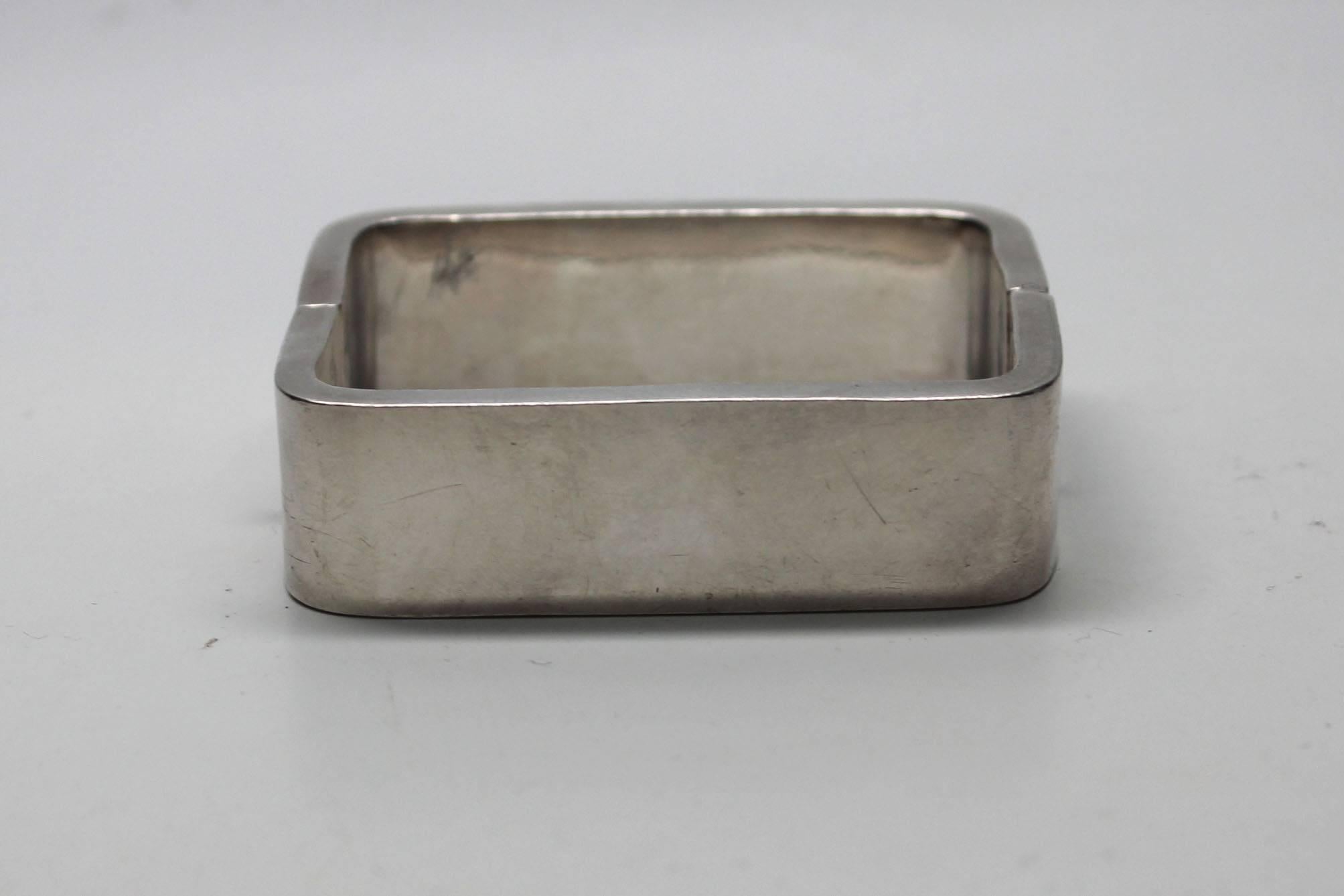 This hinged bracelet is a great statement piece. It has substantial weight and is stamped, Sterling Mexico. The jewelers mark is AAE and it has an early eagle mark. When shut the rectangle shape fits comfortably on the wrist. 