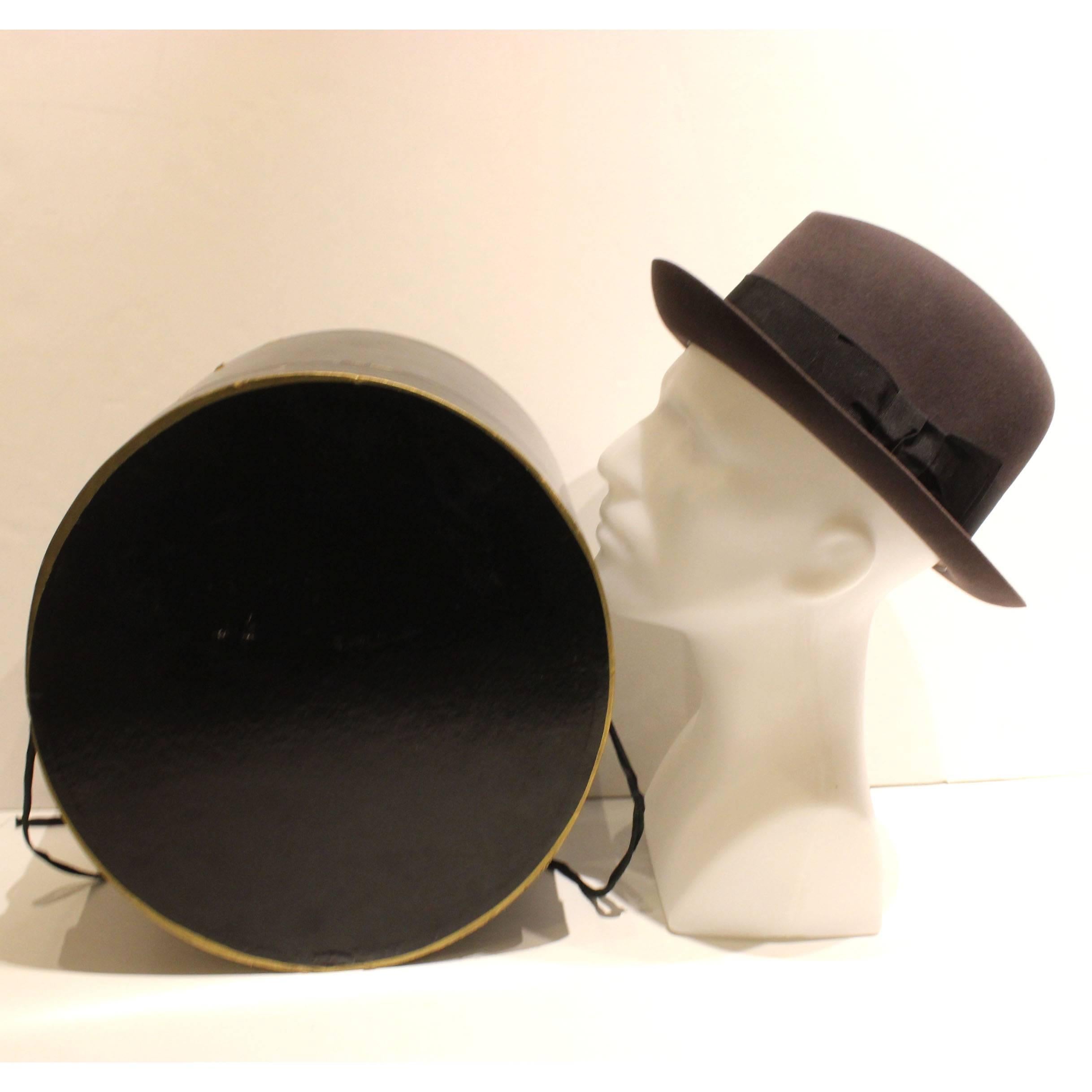 This 40's style charcoal grey fedora with a black ribbon is made by Lock & Co Hatters, one of the oldest hat stores in the world. Lock & Co Hatters, St. James Street London was established in 1759. The brim is 2.55