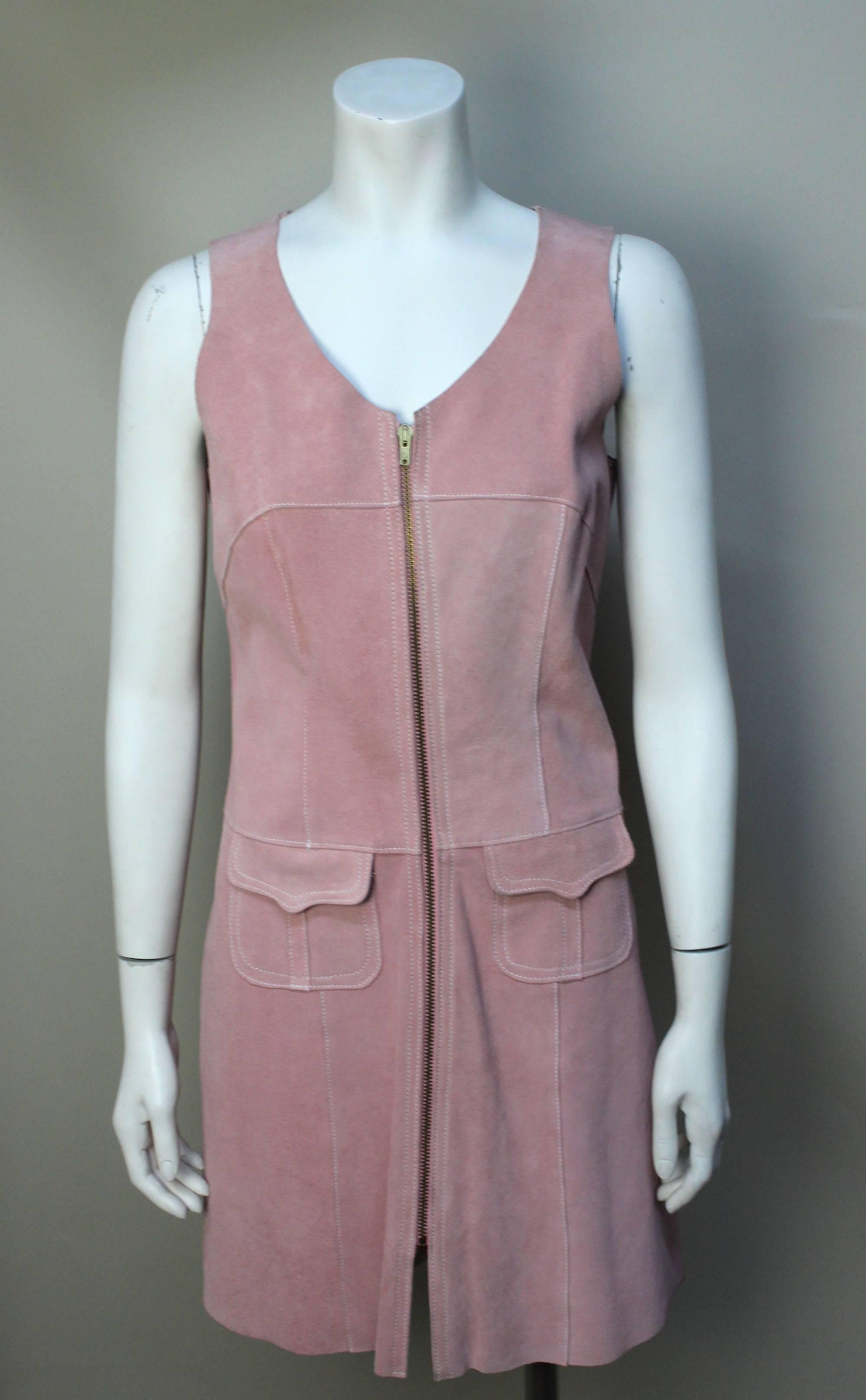 Pizzazz was located on the 6th floor of the legendary department store Lord and Taylor. It was grouped with the young New Yorker shops catering to a fashionable, youthful clientelle. This pink suede dress is the height of 1960s fashion. It can be