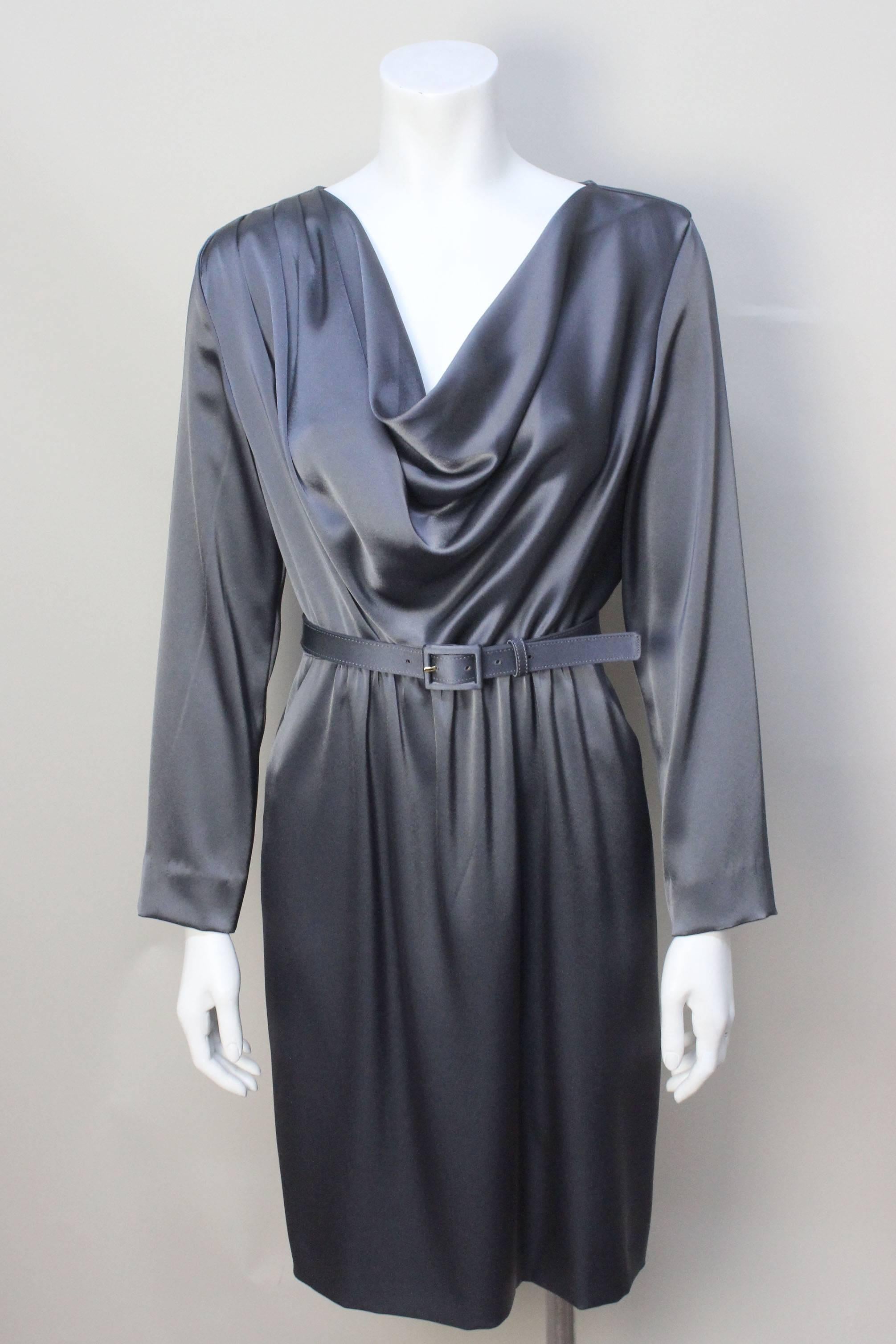This elegant St. Johns dress drapes beautifully on the body. A deep cowl neck front is weighed on the inside to hang perfectly. The acetate blend feels like the softest silk. The dress gathers slightly at the waist and is cinched with a matching