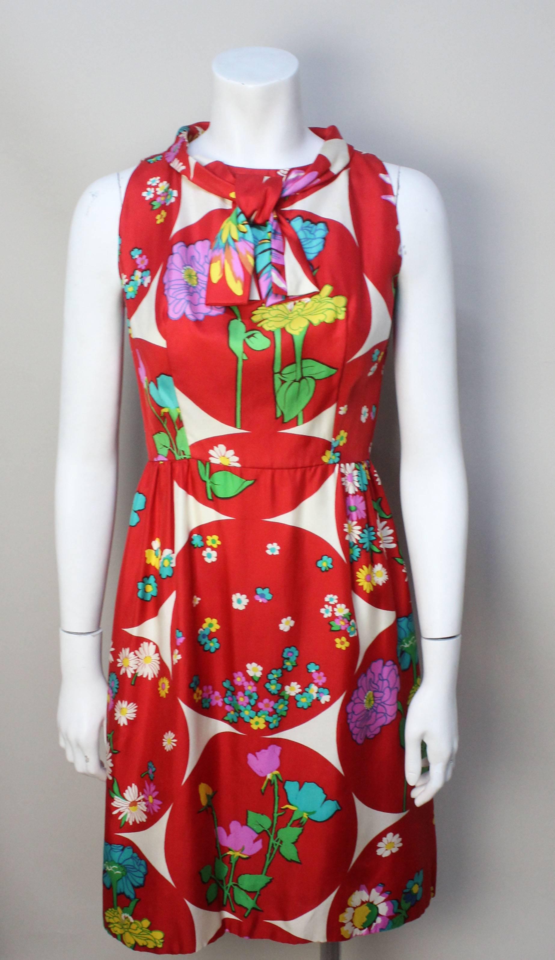 Manila born Lito Manalang was a dress designer in the 1960's for a firm named British Moderns. He was known for his simple, elegant designs based on European couture. Fabrics were his forte and this beautiful silk rayon floral is a perfect example.