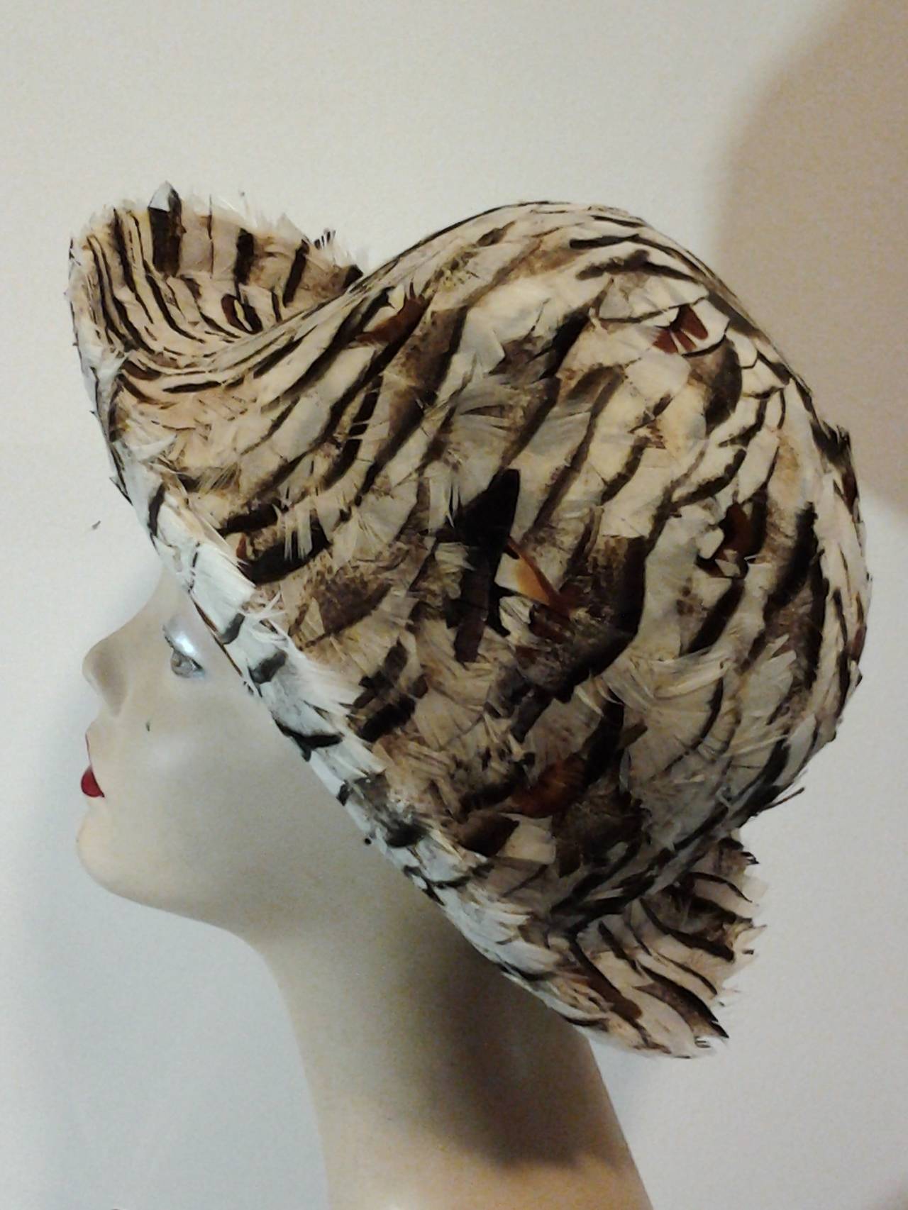 A great 1960s Franck Olive pheasant feather covered bowler style hat with upturned brim.