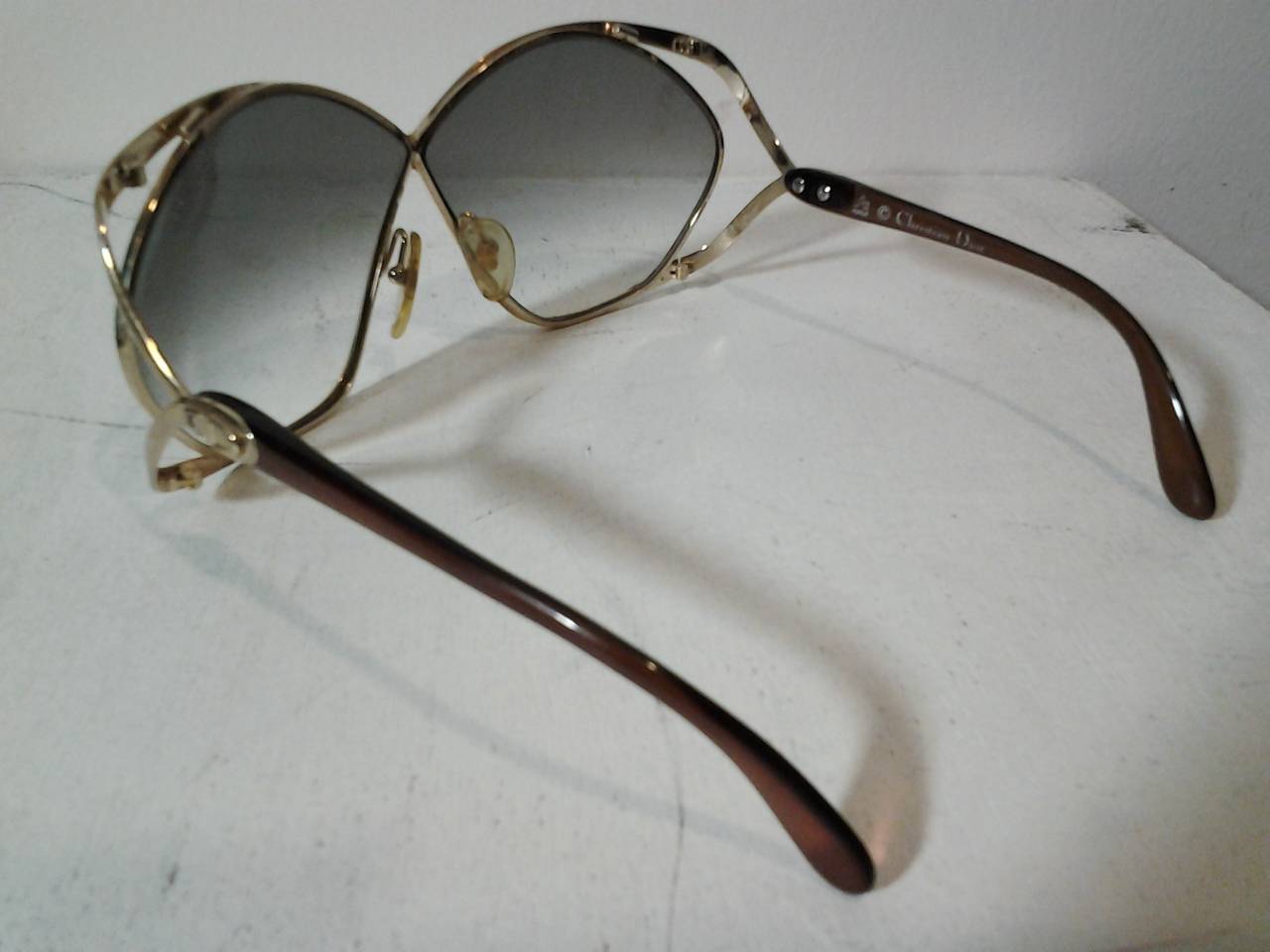 A spectacular pair of 1970s Christian Dior gradient lens sunglasses with aerodynamic metal work frames.