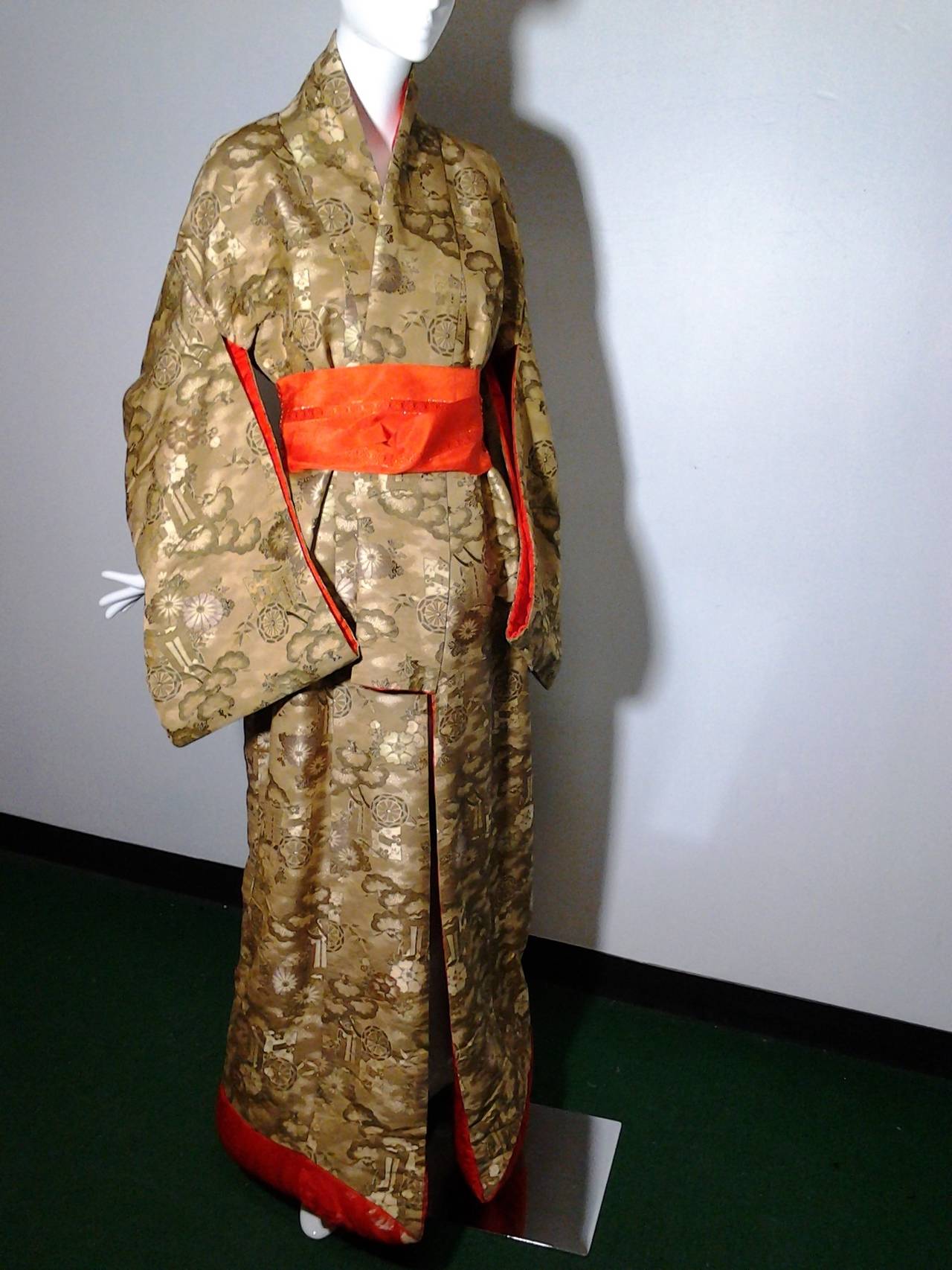 Uchikake (打掛) is a highly formal kimono worn only by a bride or at a stage performance. The Uchikake is often heavily brocaded and is supposed to be worn outside the actual kimono and obi, as a sort of coat. It is supposed to trail along the floor,