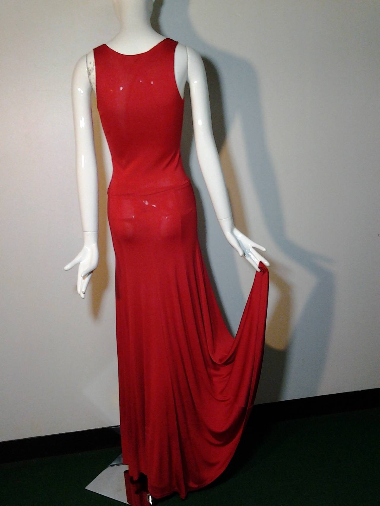 1970s Stephen Burrows red matte jersey tank-top cut disco dress with flared and flowing skirt and fitted hip.
