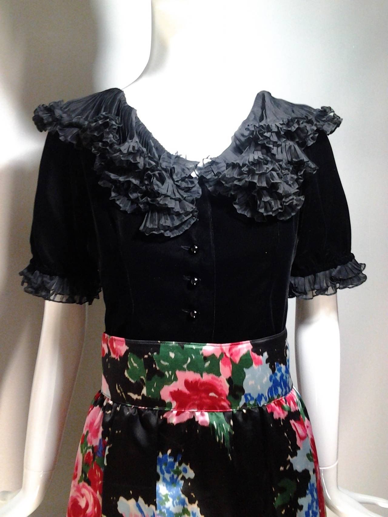 A gorgeous 1970s  2-piece ensemble by Saint Laurent:  

Skirt is high-waisted with side-slit pockets and full gathers.

Evening blouse is black rayon silk velvet with resin buttons, short puffed sleeves in a peasant style with pleated silk