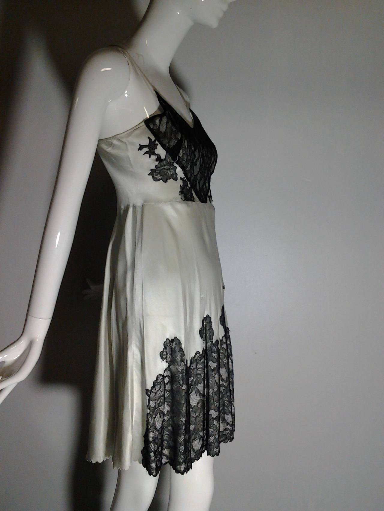 1930s silver silk charmeuse bias-cut slip with silk lace butterfly applique and trim.