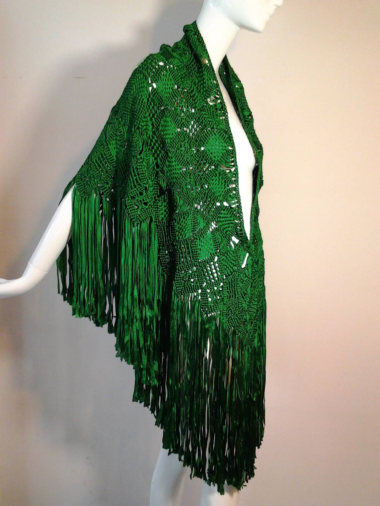 A gorgeous emerald green macrame ribbon fringed shawl.  Rayon.